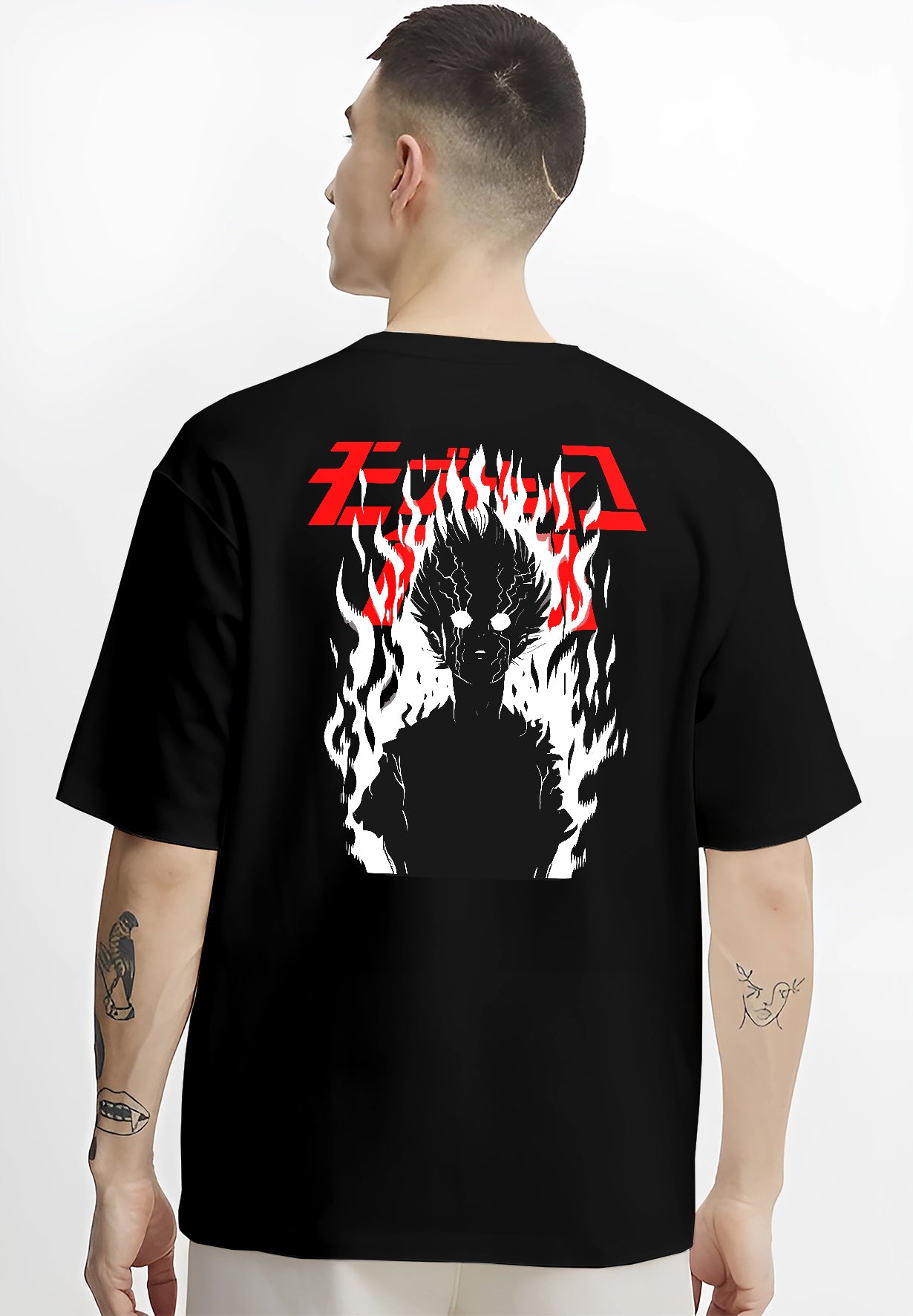 Black T-shirt worn by a male model, back view, featuring Mob Psycho 100 dark silhouette manga poster design with fiery aura and bold lettering.