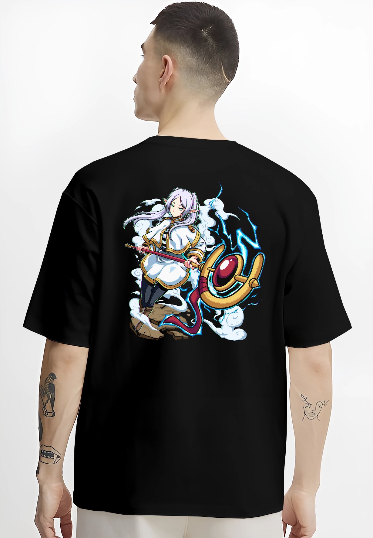 Black T-shirt worn by a male model, back view, featuring Black Clover Mereoleona retro manga graphic design with sword, lightning, and Japanese streetwear vibes.