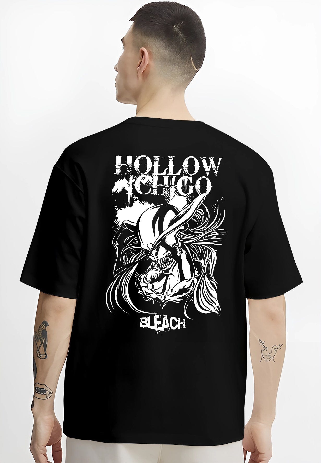 Black T-shirt worn by a male model, back view, featuring Hollow Ichigo Bleach anime poster inspired design with edgy shonen battle character artwork.