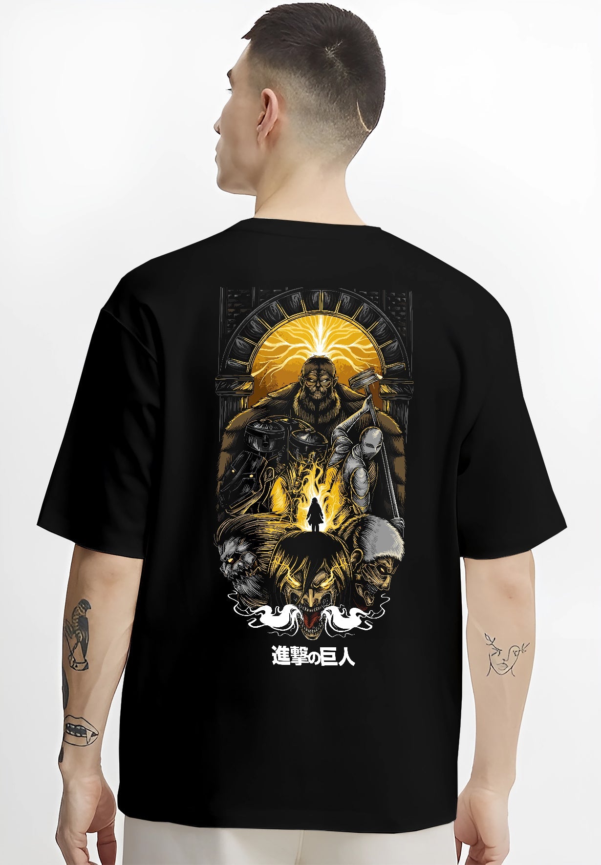 Black T-shirt worn by a male model, back view, featuring Attack on Titan shonen battle character artwork with retro manga panel inspired design in dystopian anime style.