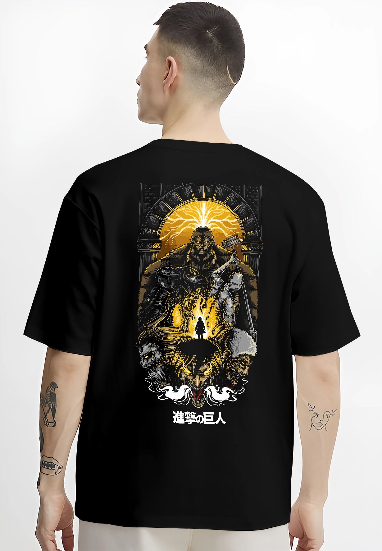 Black T-shirt worn by a male model, back view, featuring Attack on Titan shonen battle character artwork with retro manga panel inspired design in dystopian anime style.