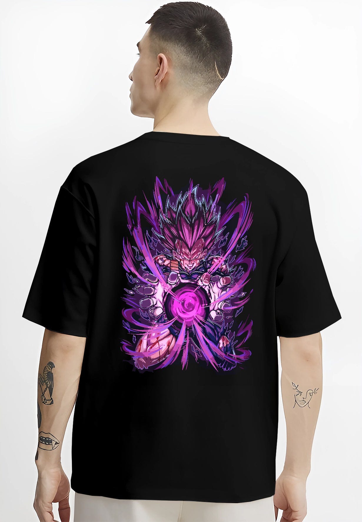 Black T-shirt worn by a male model, back view, featuring Dragon Ball Vegeta anime poster inspired artwork with shonen battle aura and retro manga graphic detail.