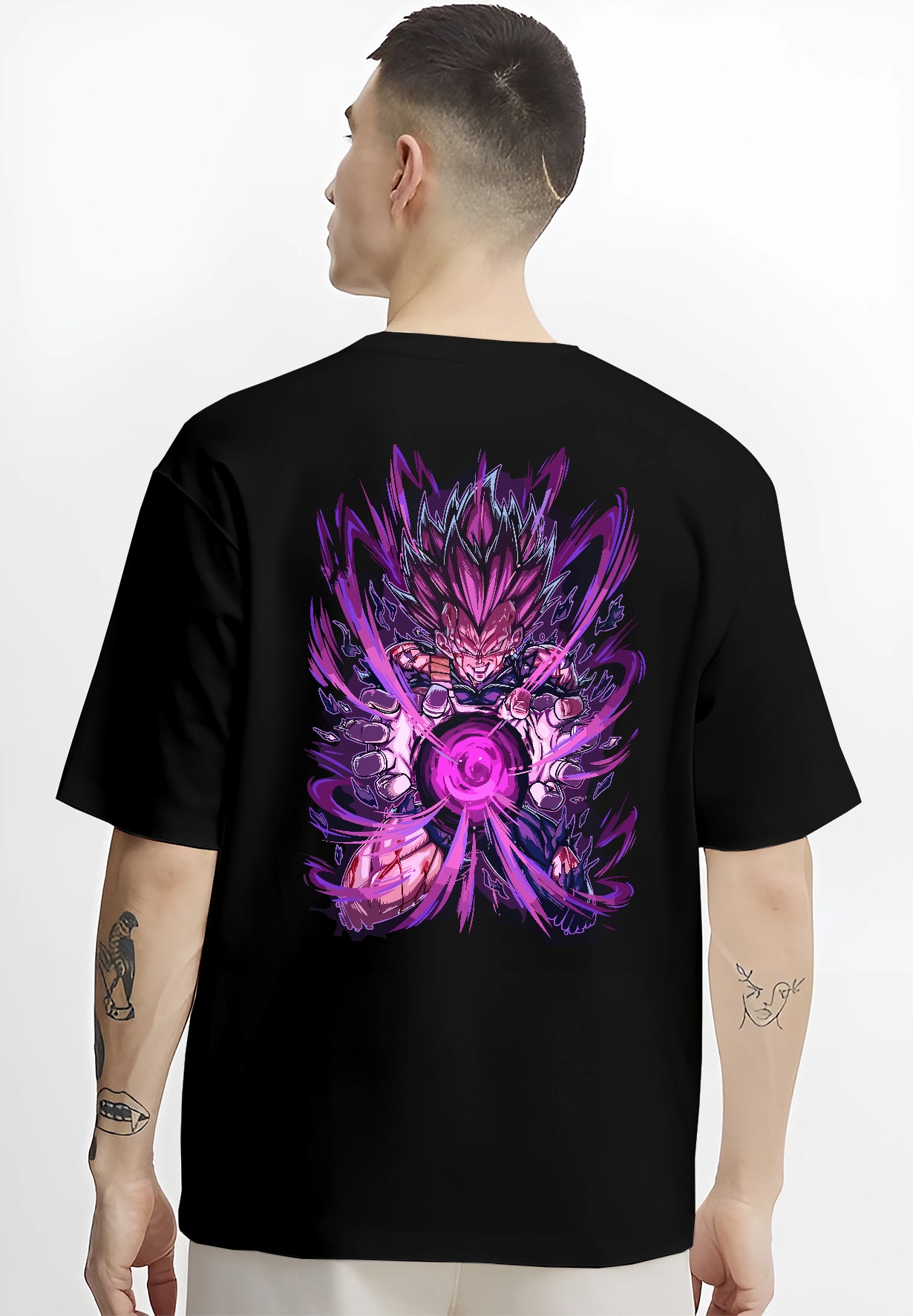 Black T-shirt worn by a male model, back view, featuring Dragon Ball Vegeta anime poster inspired artwork with shonen battle aura and retro manga graphic detail.