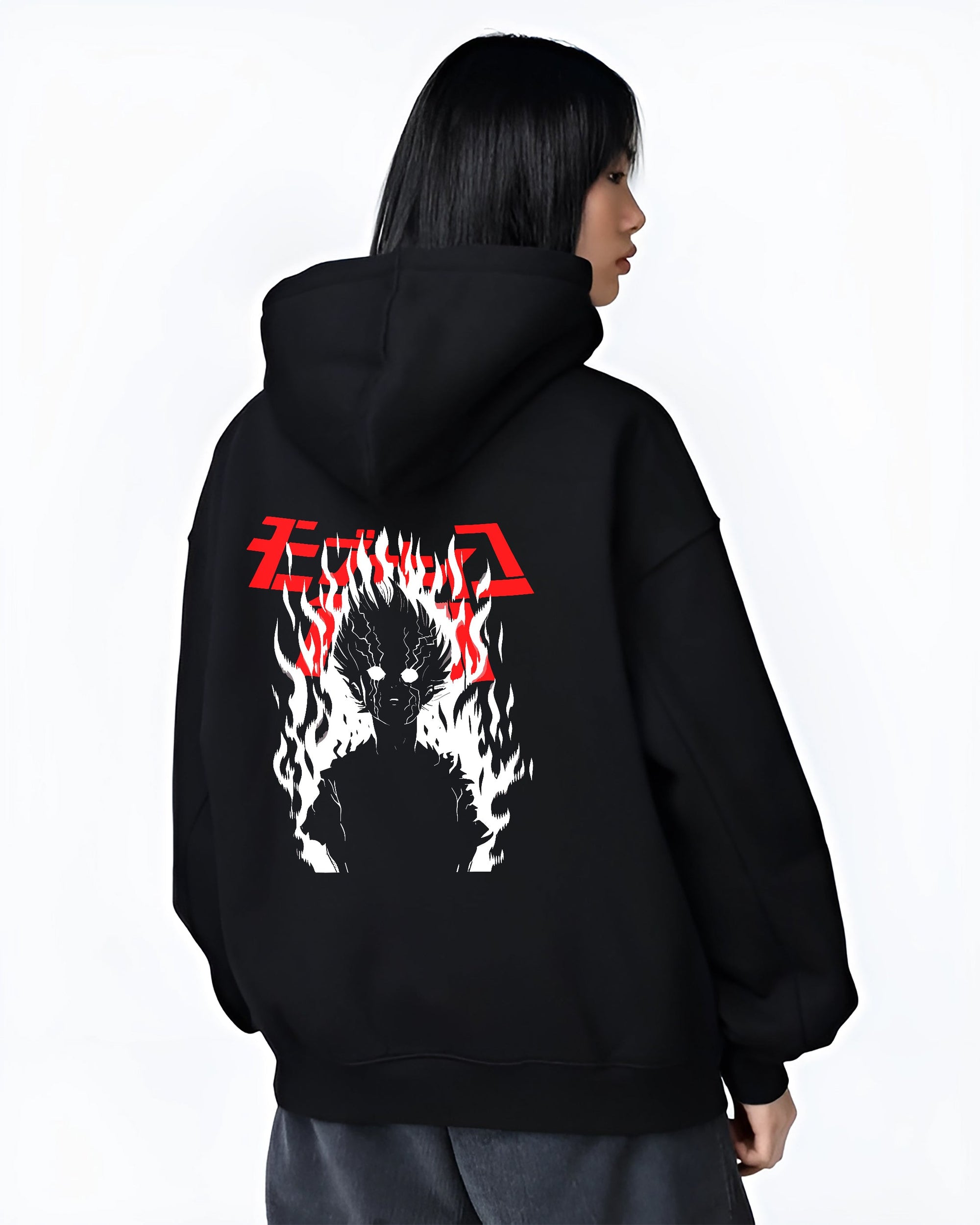Black hoodie worn by a female model, back view, featuring Mob Psycho 100 silhouette engulfed in flames retro streetwear inspired manga artwork.