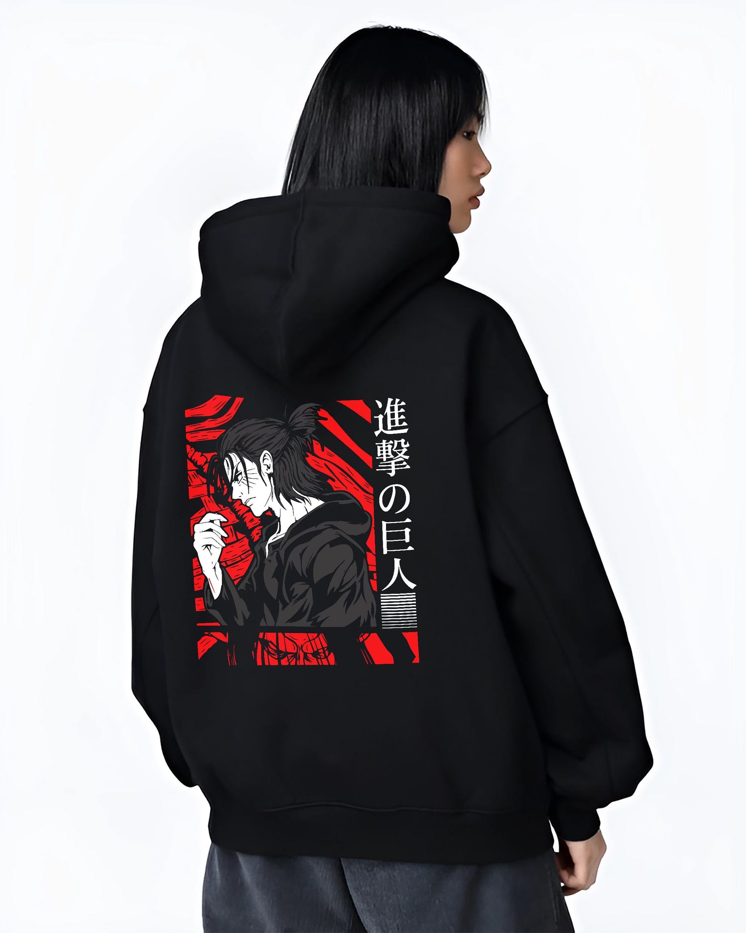 Black hoodie worn by a female model, back view, featuring Attack on Titan Eren Yeager retro manga graphic portrait design in anime poster inspired artwork with bold red style.