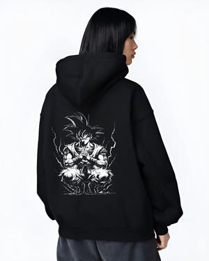 Black hoodie worn by a female model, back view, featuring Dragon Ball Goku anime poster inspired artwork with meditation stance and lightning aura in dark manga style.