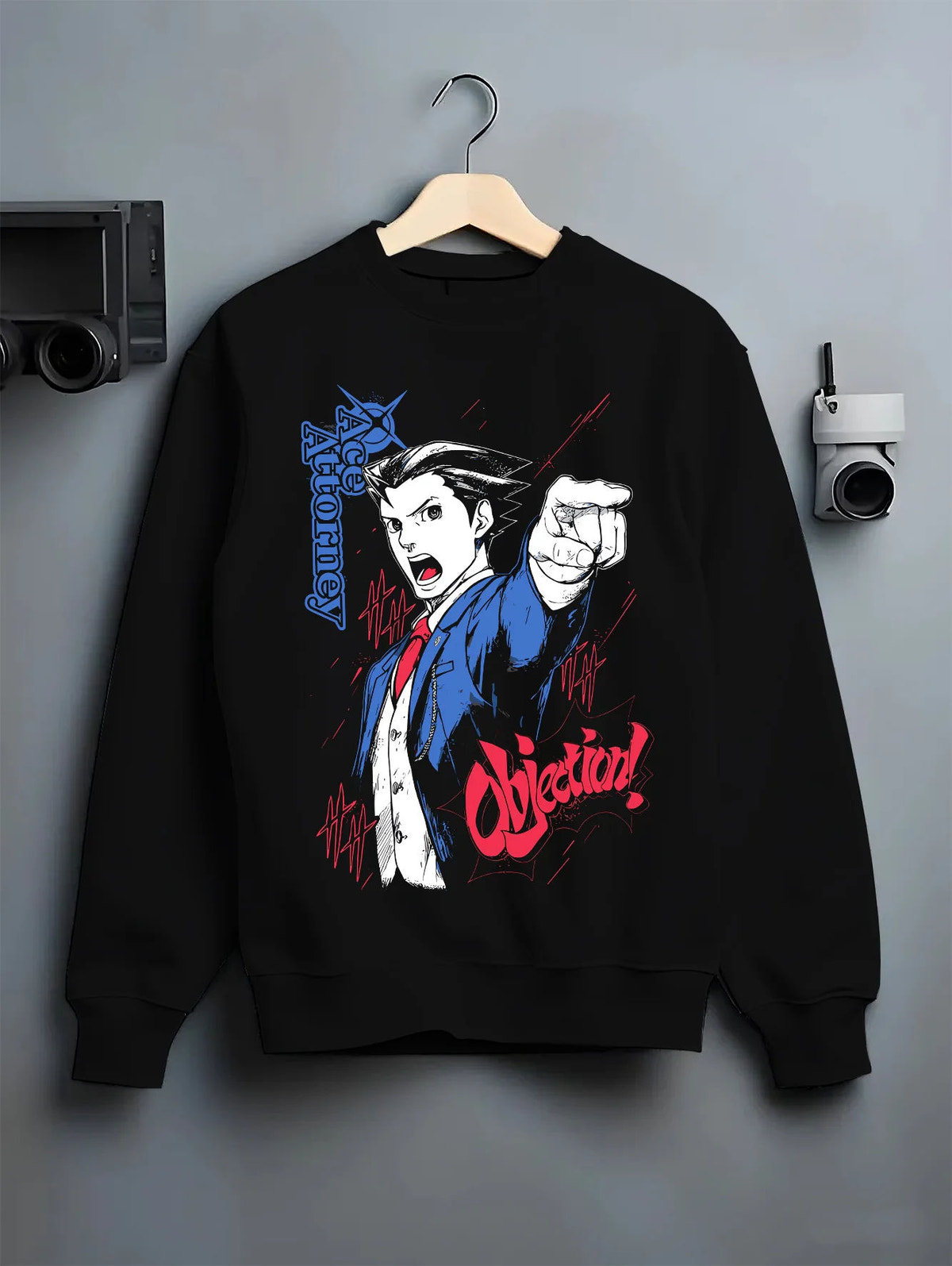 Black crewneck sweatshirt on hanger showing Phoenix Wright from Ace Attorney: Objection pose