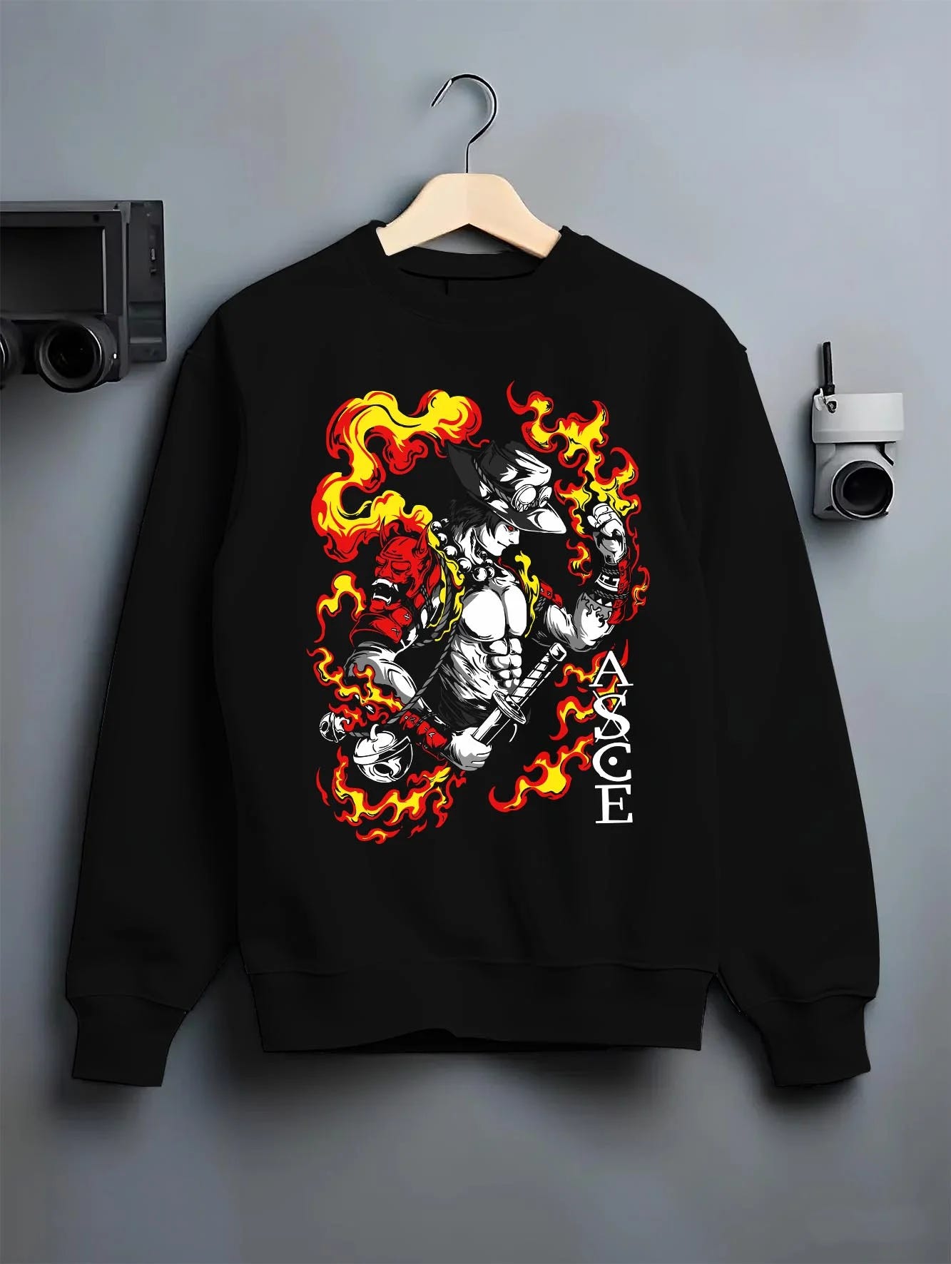 Black crewneck sweatshirt on hanger, featuring Portgas D. Ace retro streetwear flame motif with samurai oni mask in shonen manga inspired artwork