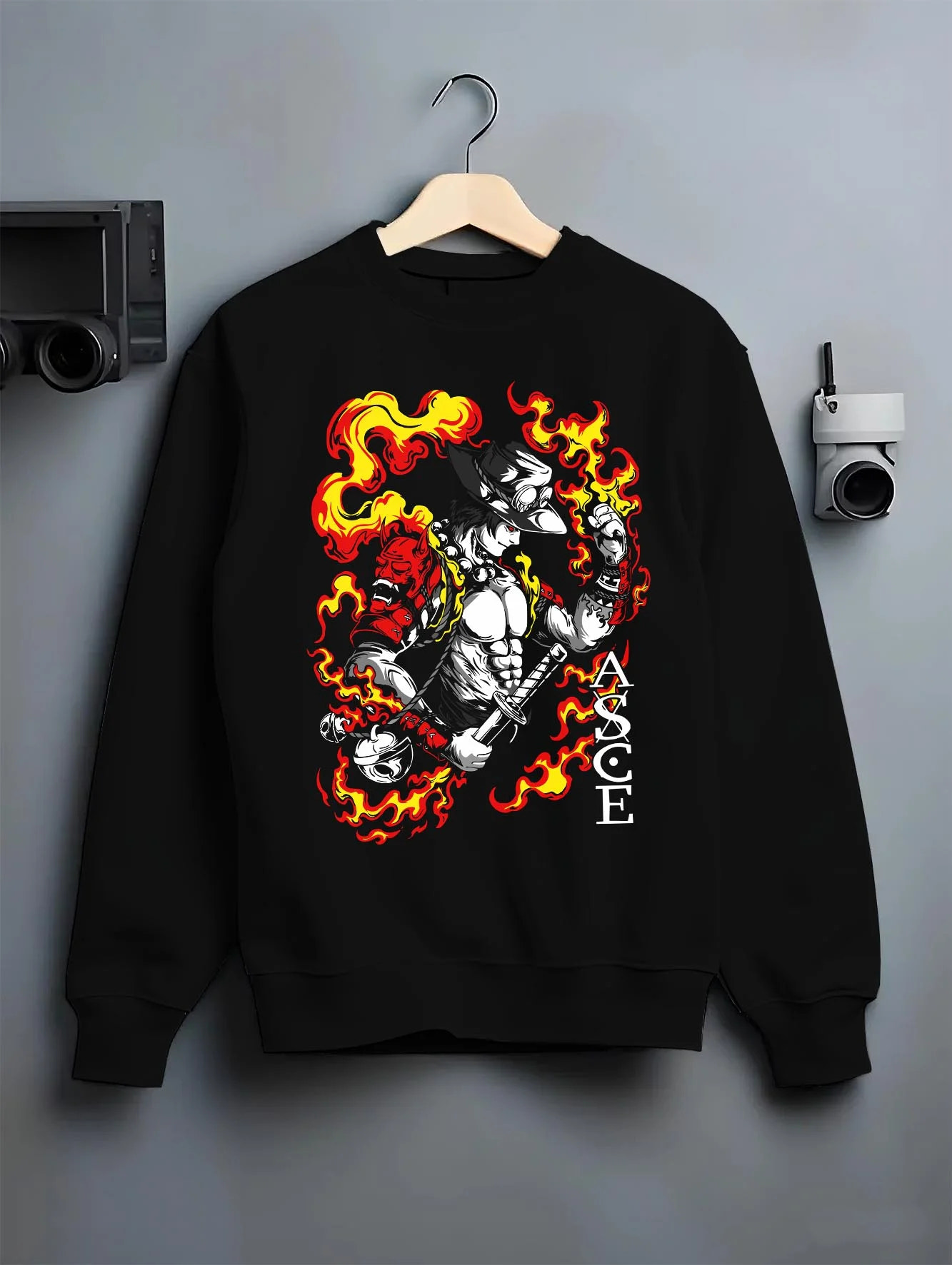 Black crewneck sweatshirt on hanger, featuring Portgas D. Ace retro streetwear flame motif with samurai oni mask in shonen manga inspired artwork