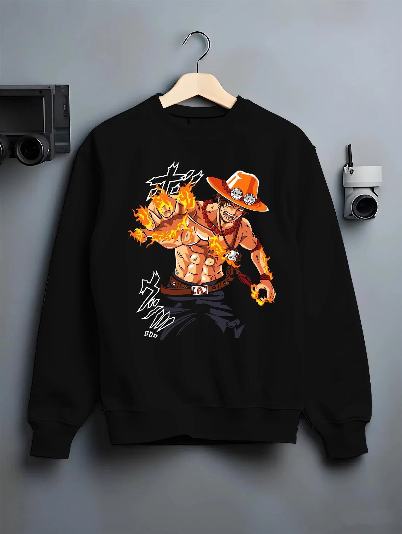 Black crewneck sweatshirt on hanger with Portgas Ace Blaze Hoodie One Piece Ember Aura Flames graphic bold anime graphic.
