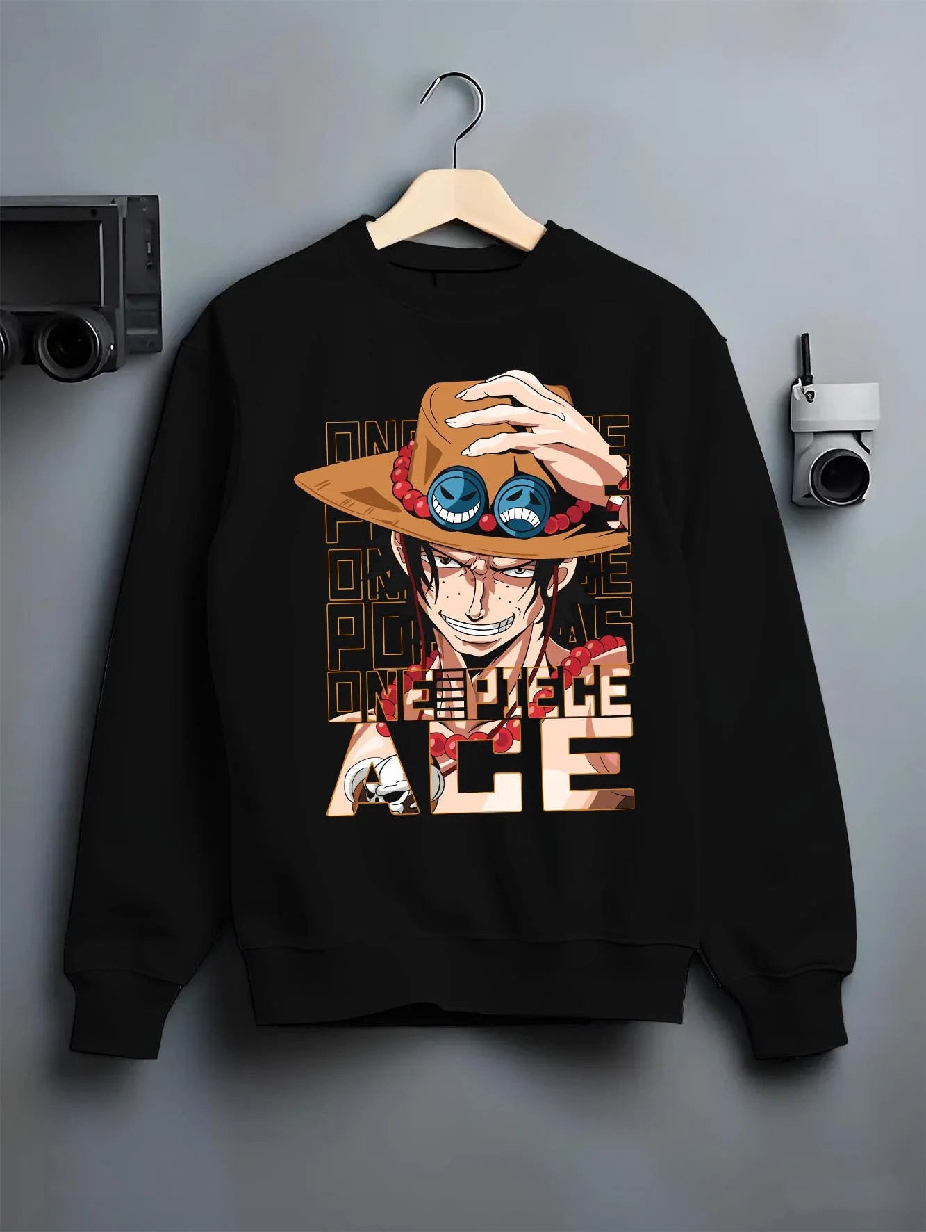 Black crewneck sweatshirt on hanger with Portgas D Ace Hoodie One Piece Freckled Pirate Grin graphic premium wear.