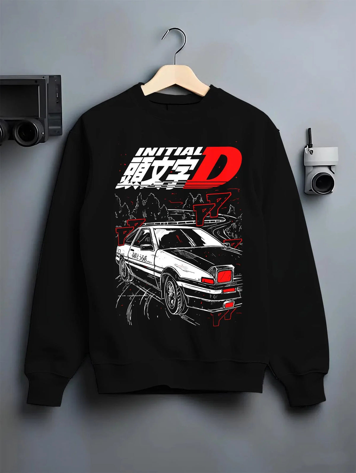 Black crewneck sweatshirt on hanger featuring Takumi Fujiwara AE86 Initial D drift racing artwork.