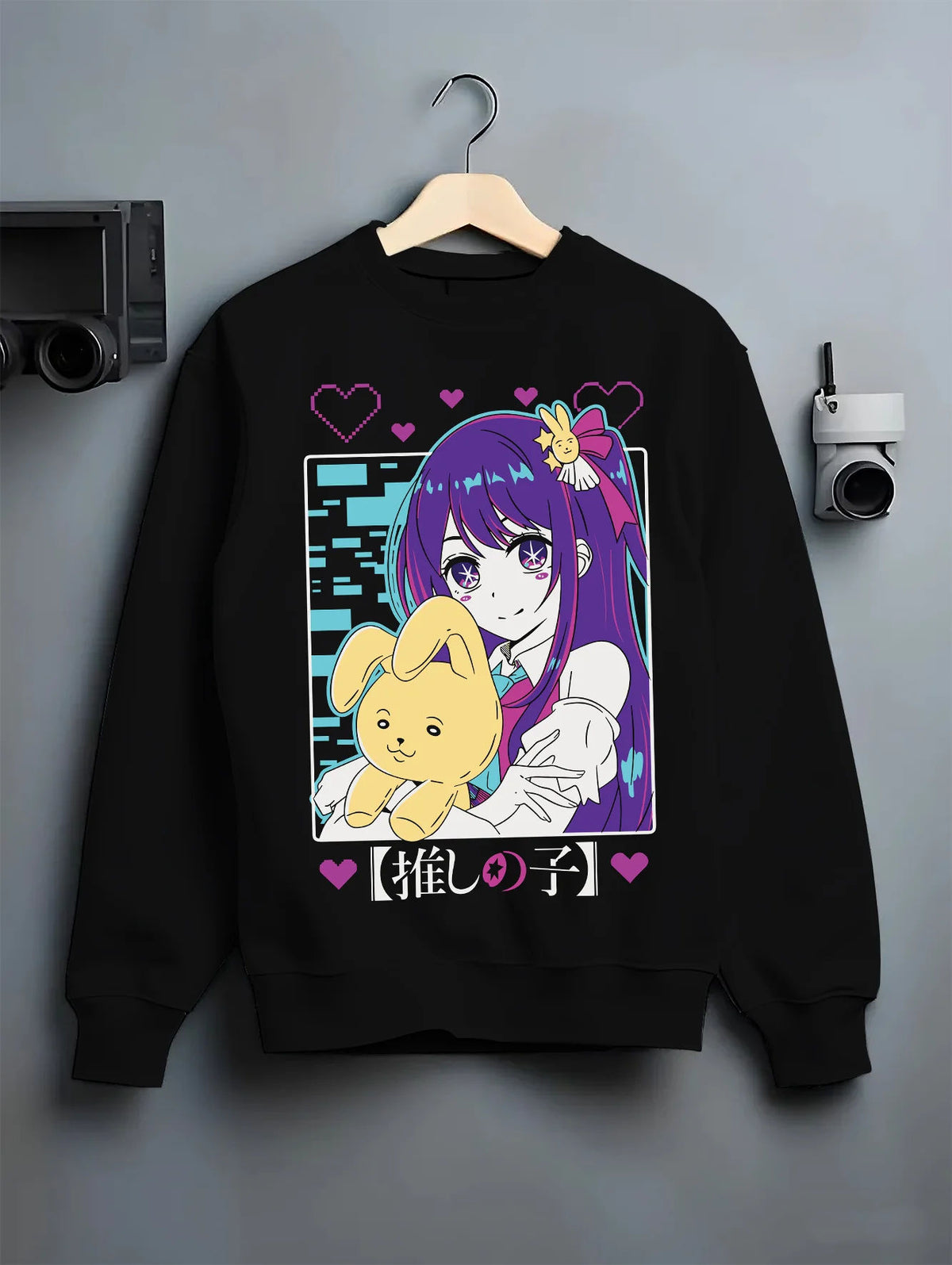 Black crewneck sweatshirt on hanger showing Ai Hoshino from Oshi no Ko: purple-haired girl with plush toy