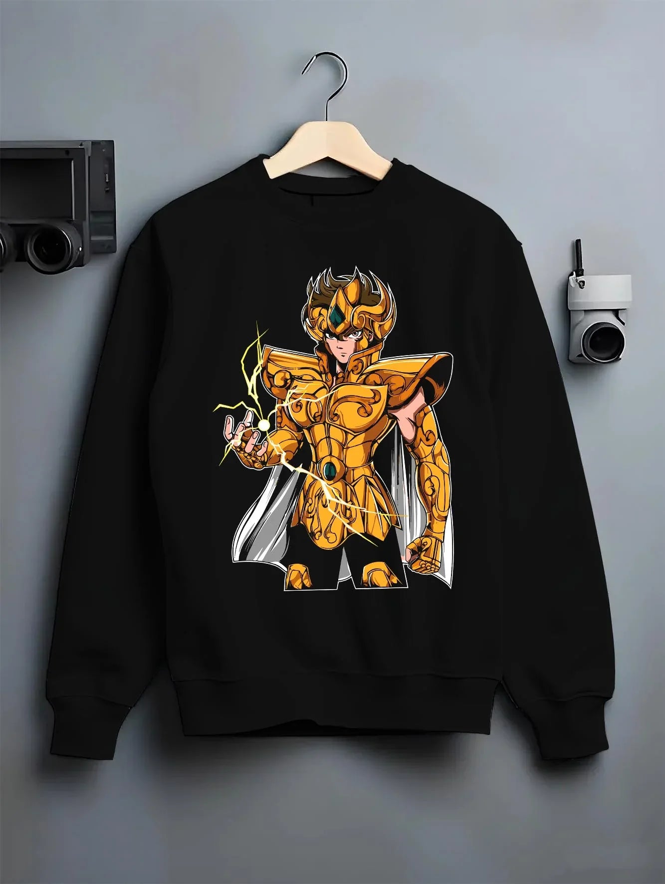 Black crewneck sweatshirt on hanger with Leo Gold Saint Hoodie Saint Seiya Celestial Zodiac graphic premium wear.