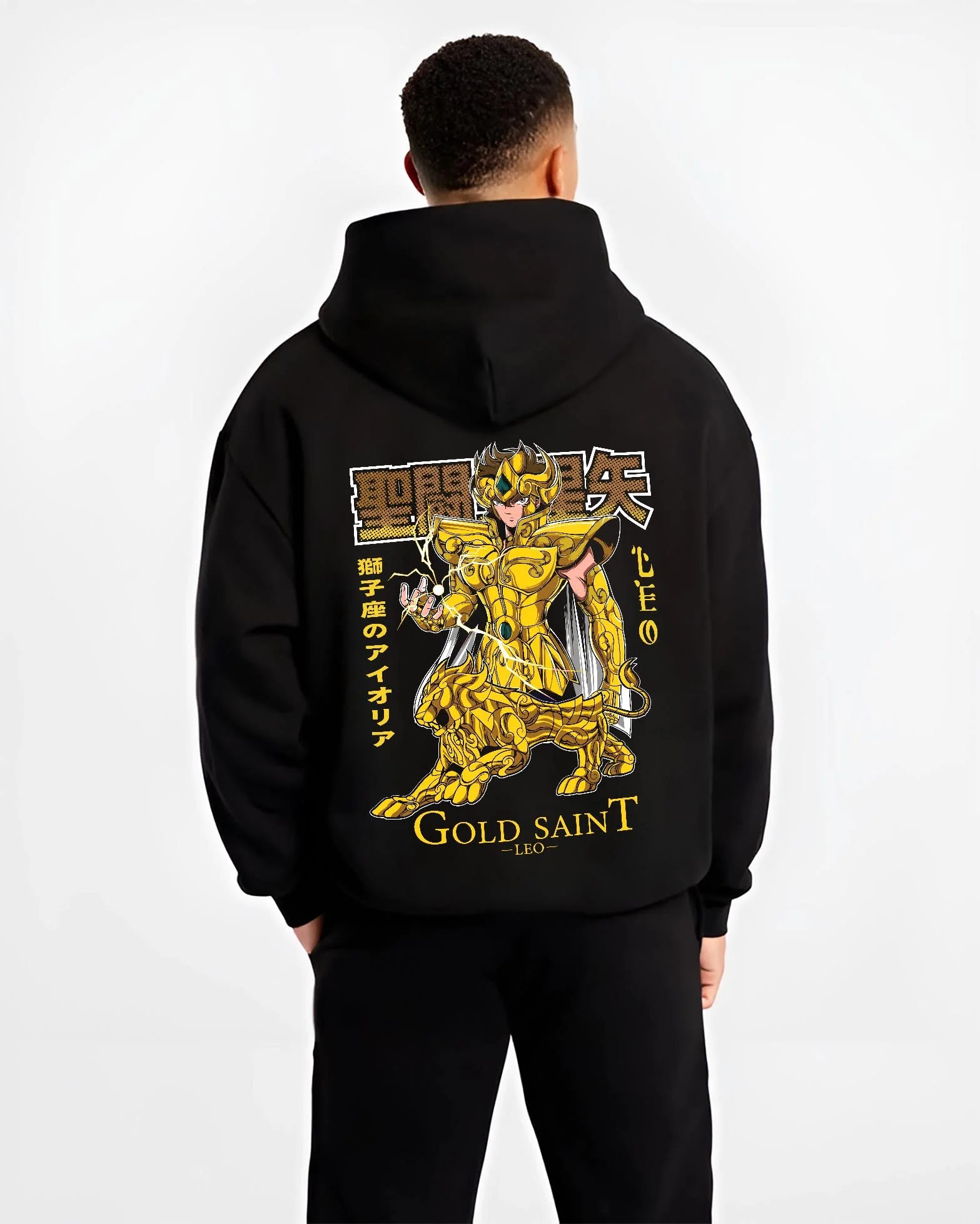 Black hoodie worn by male model, back view with Saint Seiya Aiolia Hoodie Gold Saint Leo Armor Jumper graphic premium wear.