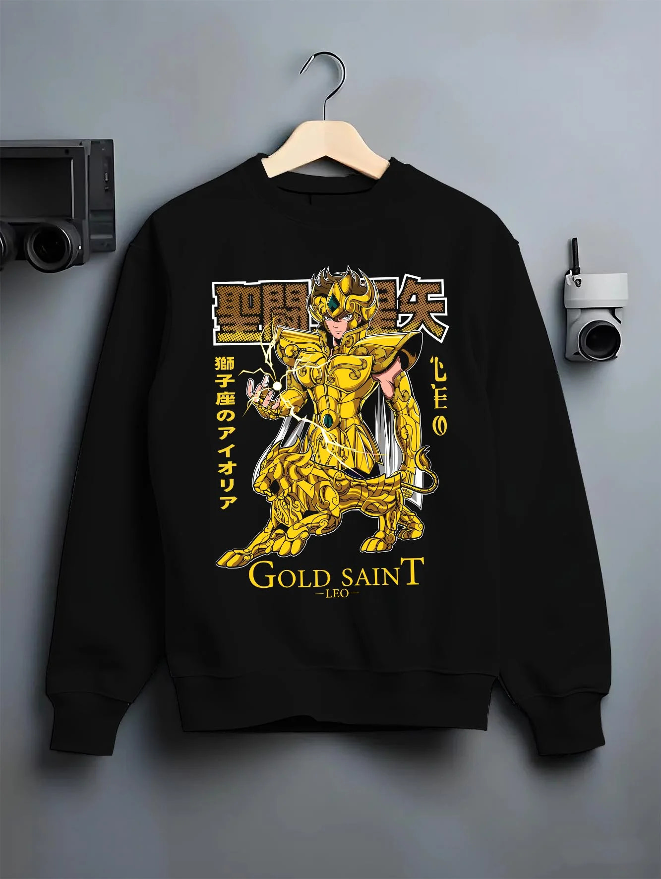 Black crewneck sweatshirt on hanger with Saint Seiya Aiolia Hoodie Gold Saint Leo Armor Jumper graphic premium wear.