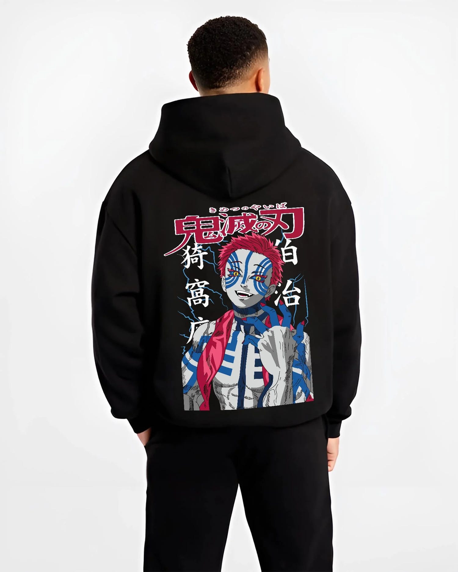 Black hoodie worn by male model, back view with Akaza Demon Slayer Hoodie Fierce Blood Demon Fist graphic bold anime graphic.