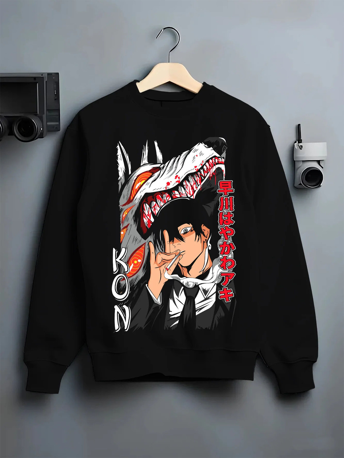 Black crewneck sweatshirt on hanger with Aki Hayakawa / Kon from Chainsaw Man illustrated back graphic