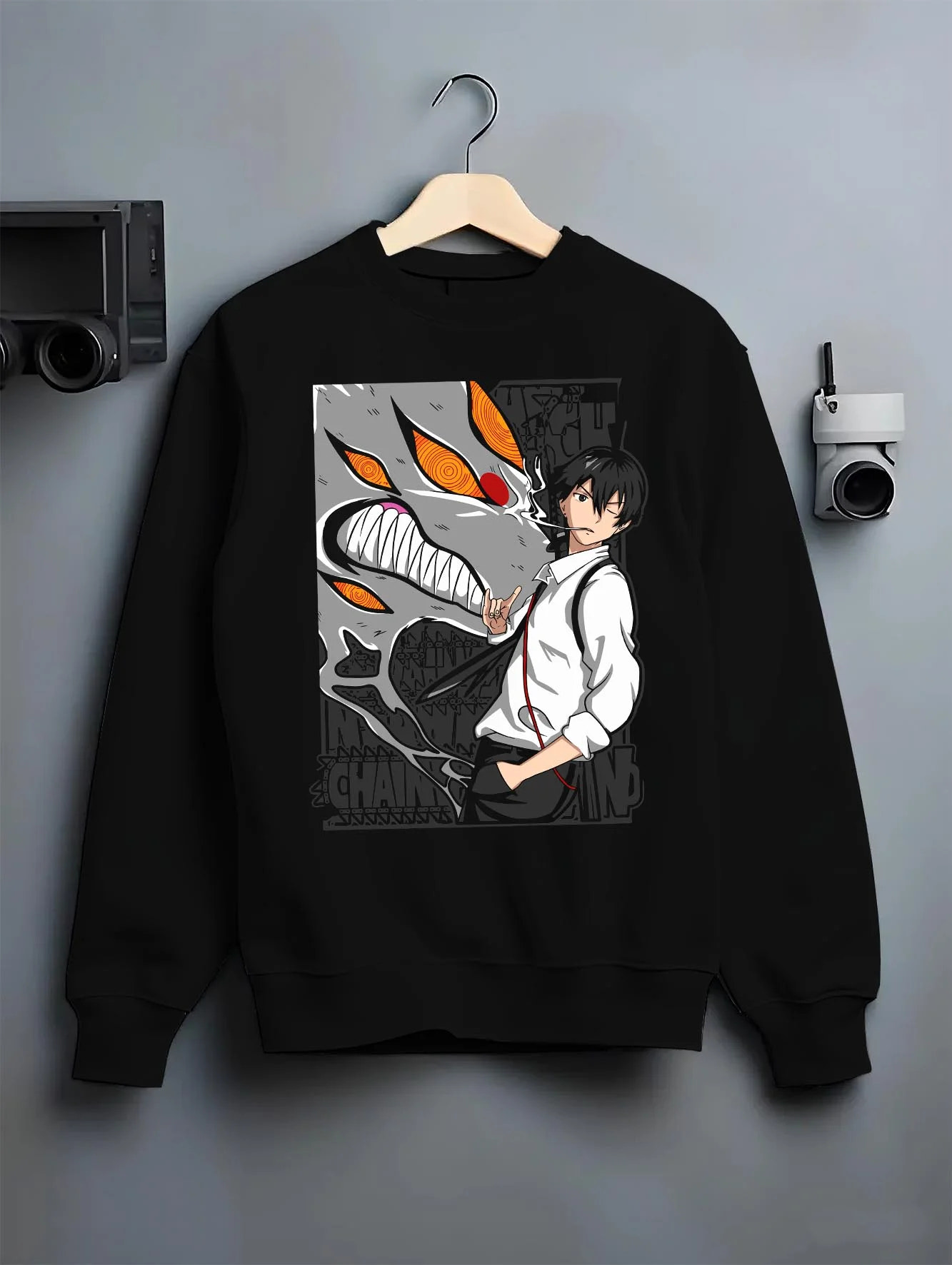 Black crewneck sweatshirt on hanger with Chainsaw Man Hoodie Denji Devil Hunter Chainsaw Blades graphic Denji anime design.