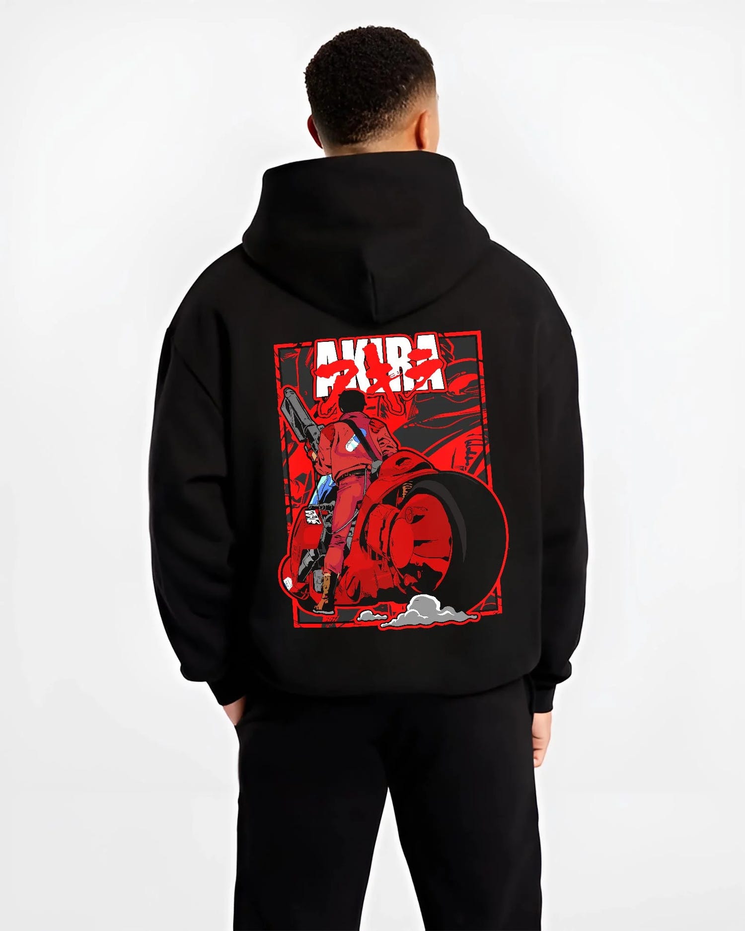 Black hoodie worn by male model, back view with Akira Neo Tokyo Hoodie Kaneda Bike Retro Future Scene graphic premium wear.