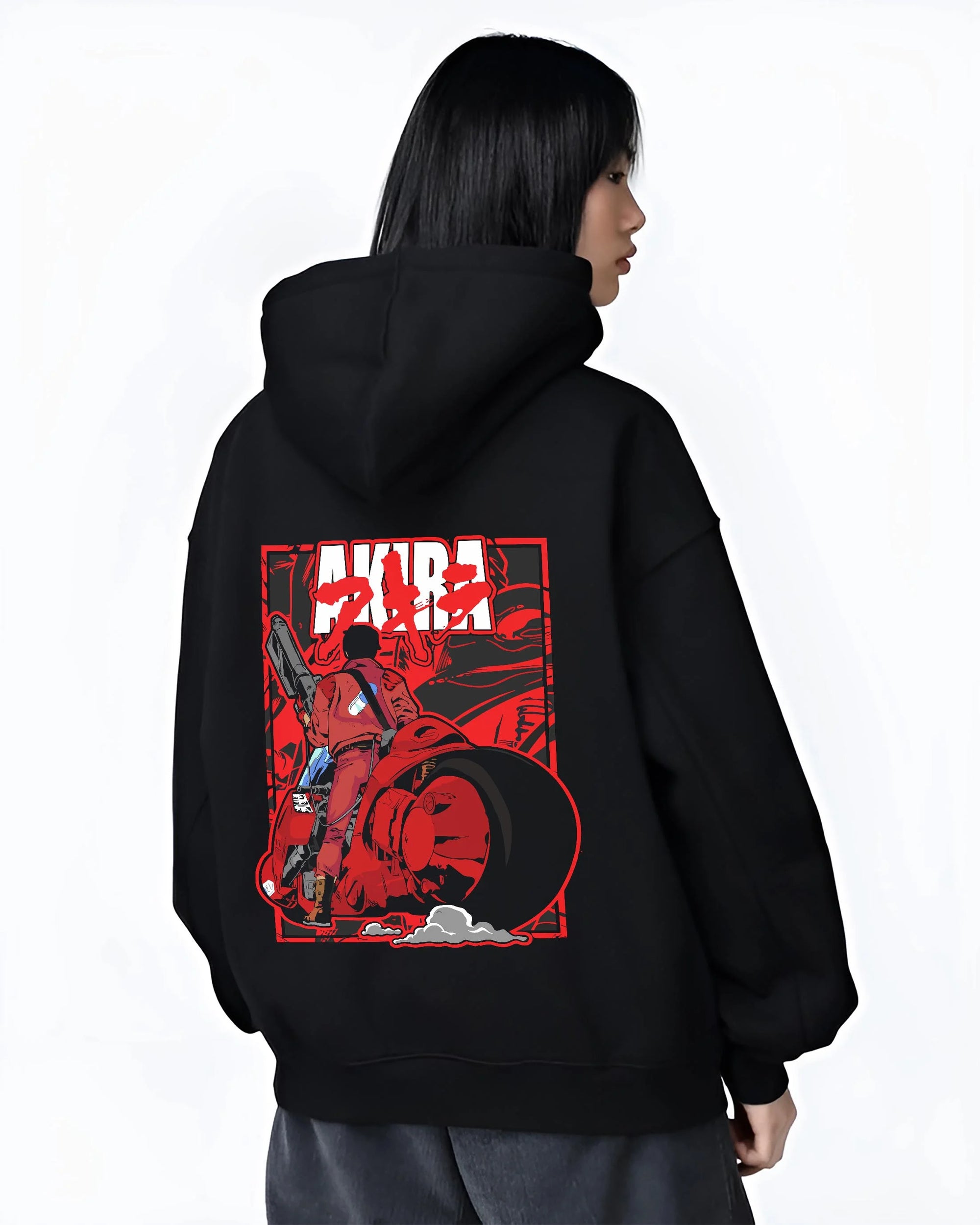 Black hoodie worn by female model, back view with Akira Neo Tokyo Hoodie Kaneda Bike Retro Future Scene graphic Akira anime graphic.