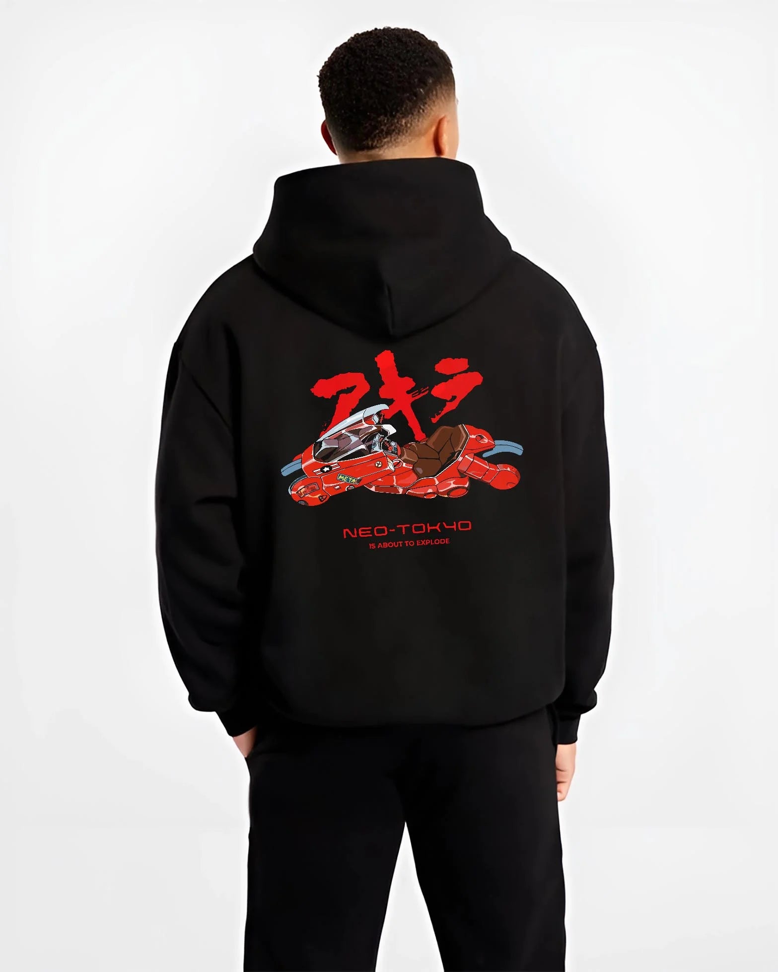 Black hoodie worn by male model, back view with Akira Neo Tokyo Hoodie Kaneda Red Bike Retro Poster graphic Akira anime graphic.