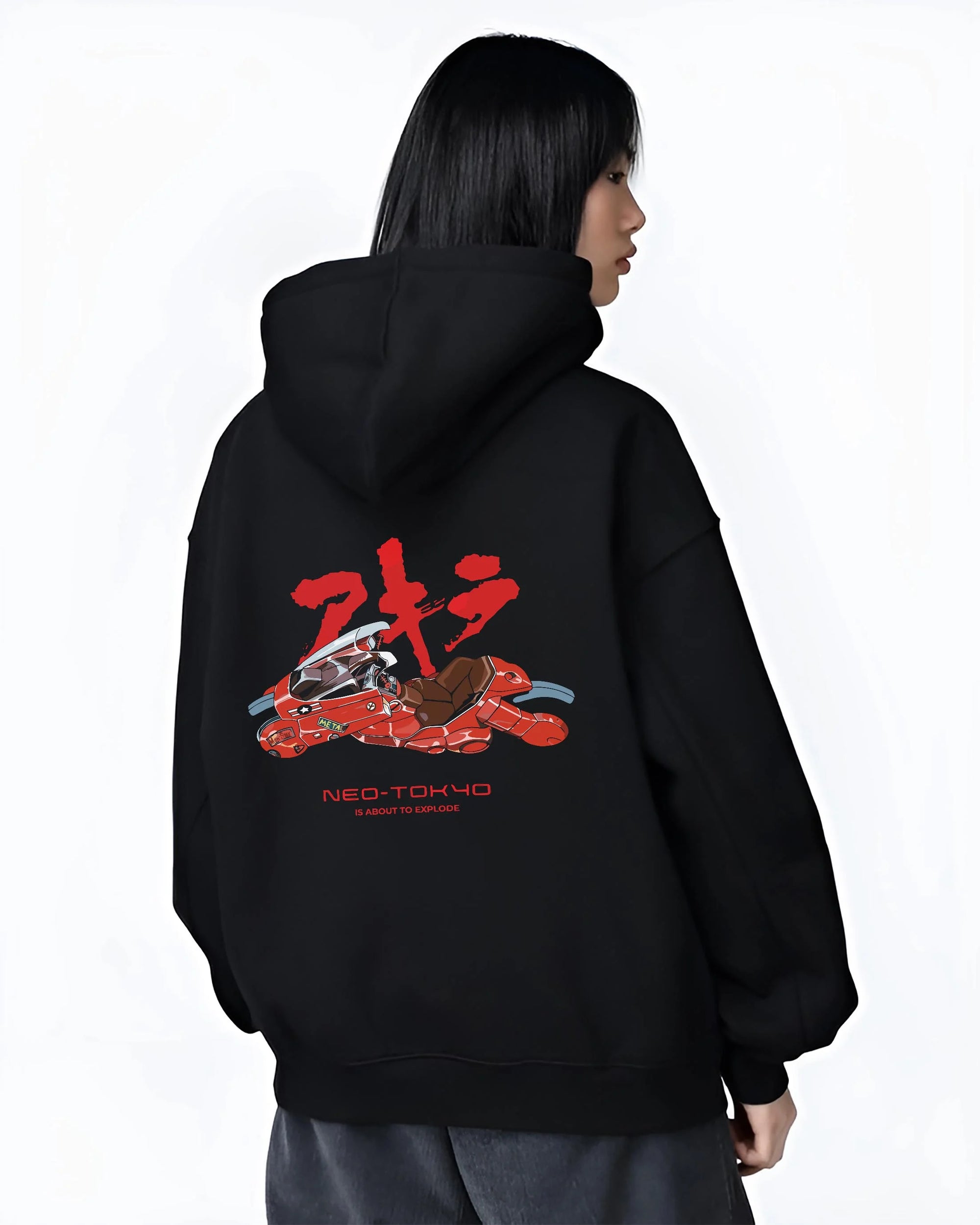 Black hoodie worn by female model, back view with Akira Neo Tokyo Hoodie Kaneda Red Bike Retro Poster graphic premium wear.