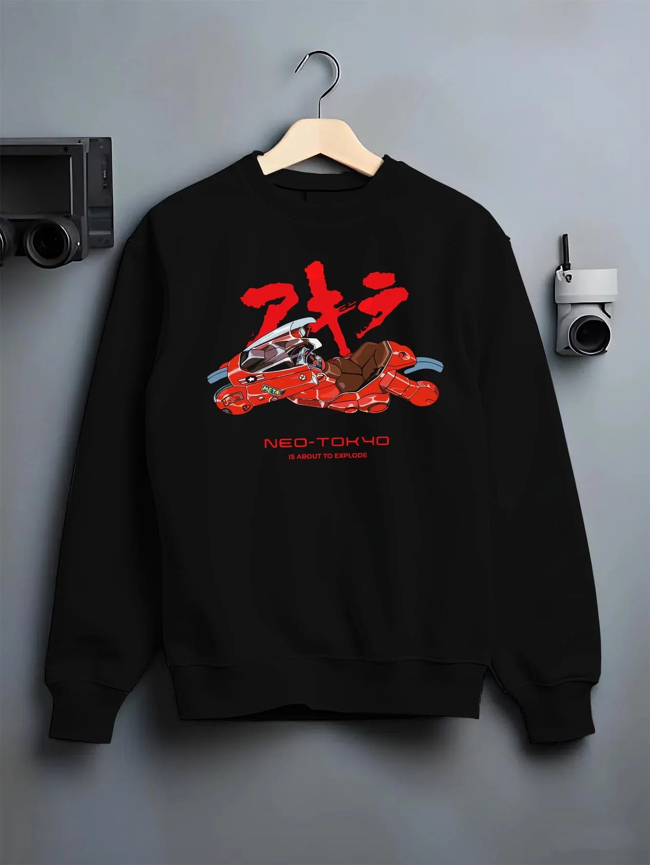 Black crewneck sweatshirt on hanger with Akira Neo Tokyo Hoodie Kaneda Red Bike Retro Poster graphic premium wear.