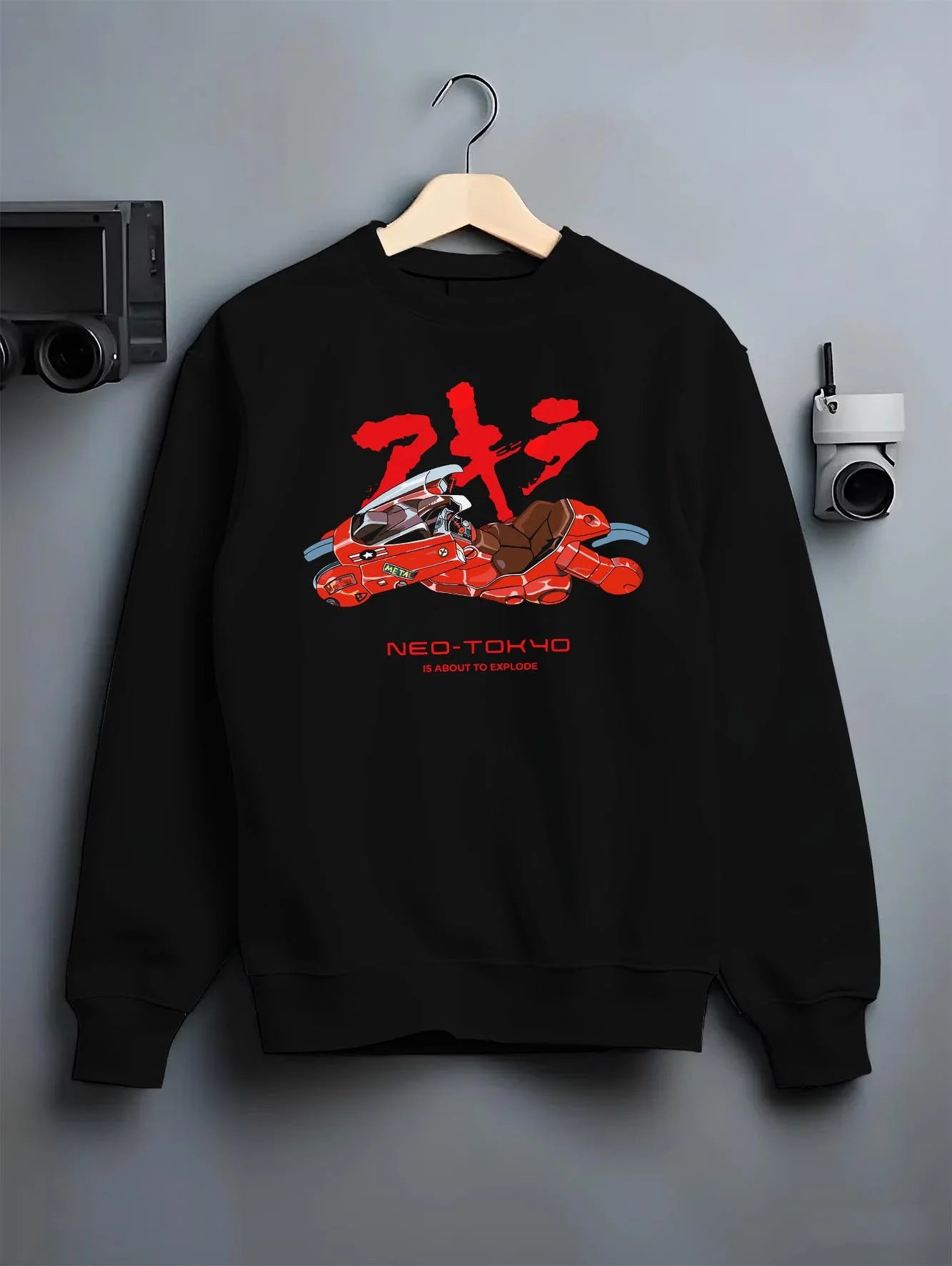 Black crewneck sweatshirt on hanger with Akira Neo Tokyo Hoodie Kaneda Red Bike Retro Poster graphic premium wear.