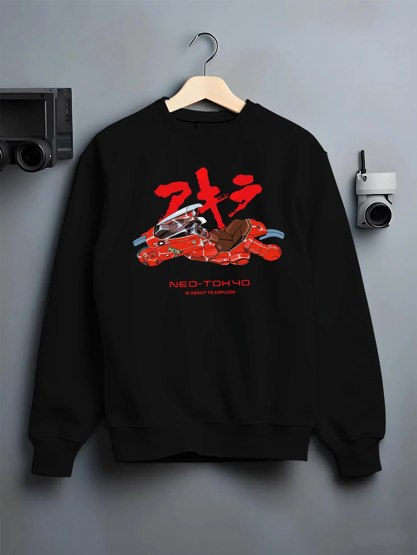 Black crewneck sweatshirt on hanger with Akira Neo Tokyo Hoodie Kaneda Red Bike Retro Poster graphic premium wear.