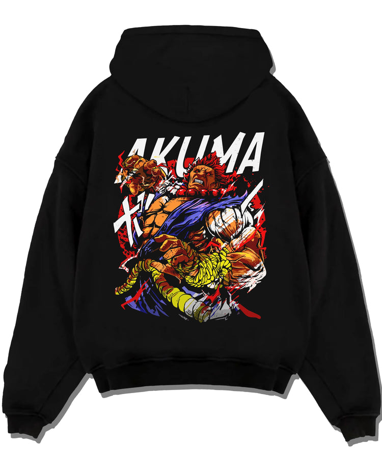 Black pullover hoodie laid flat with Akuma Max Power Hoodie Street Fighter Fiery Demon Aura graphic premium wear.