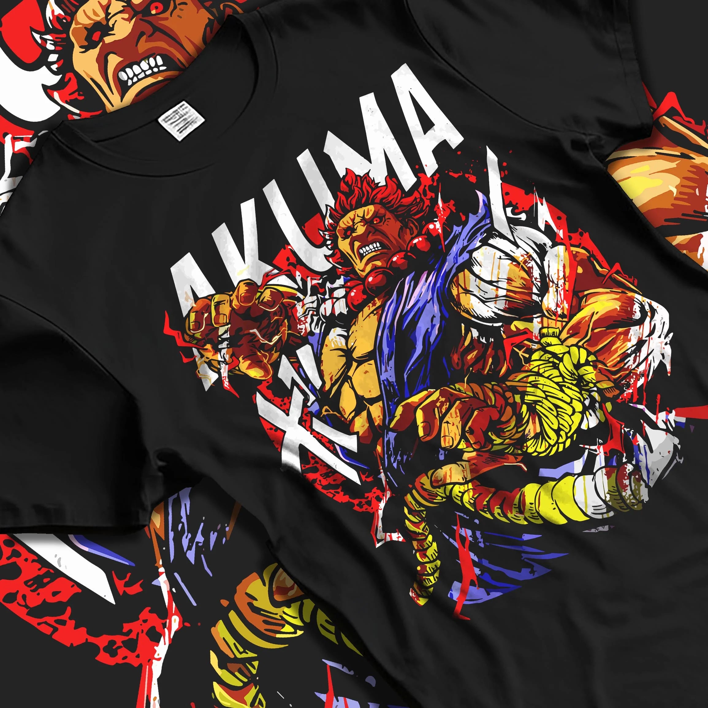Black T-shirt laid flat with natural folds with Akuma Max Power Hoodie Street Fighter Fiery Demon Aura graphic bold anime graphic.