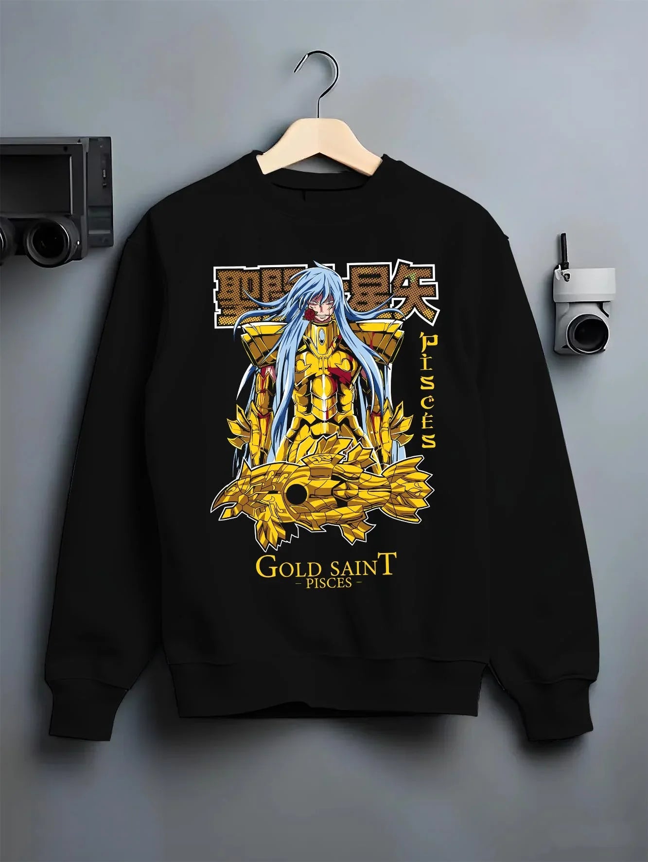 Black crewneck sweatshirt on hanger with Pisces Gold Saint Hoodie Saint Seiya Mythic Zodiac graphic streetwear graphic.