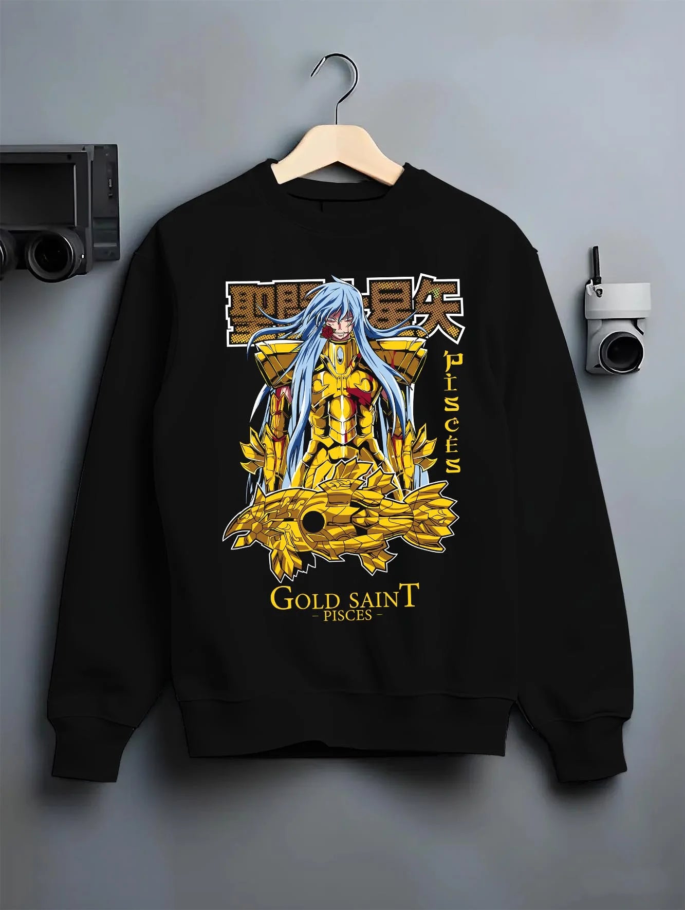 Black crewneck sweatshirt on hanger with Pisces Gold Saint Hoodie Saint Seiya Mythic Zodiac graphic streetwear graphic.