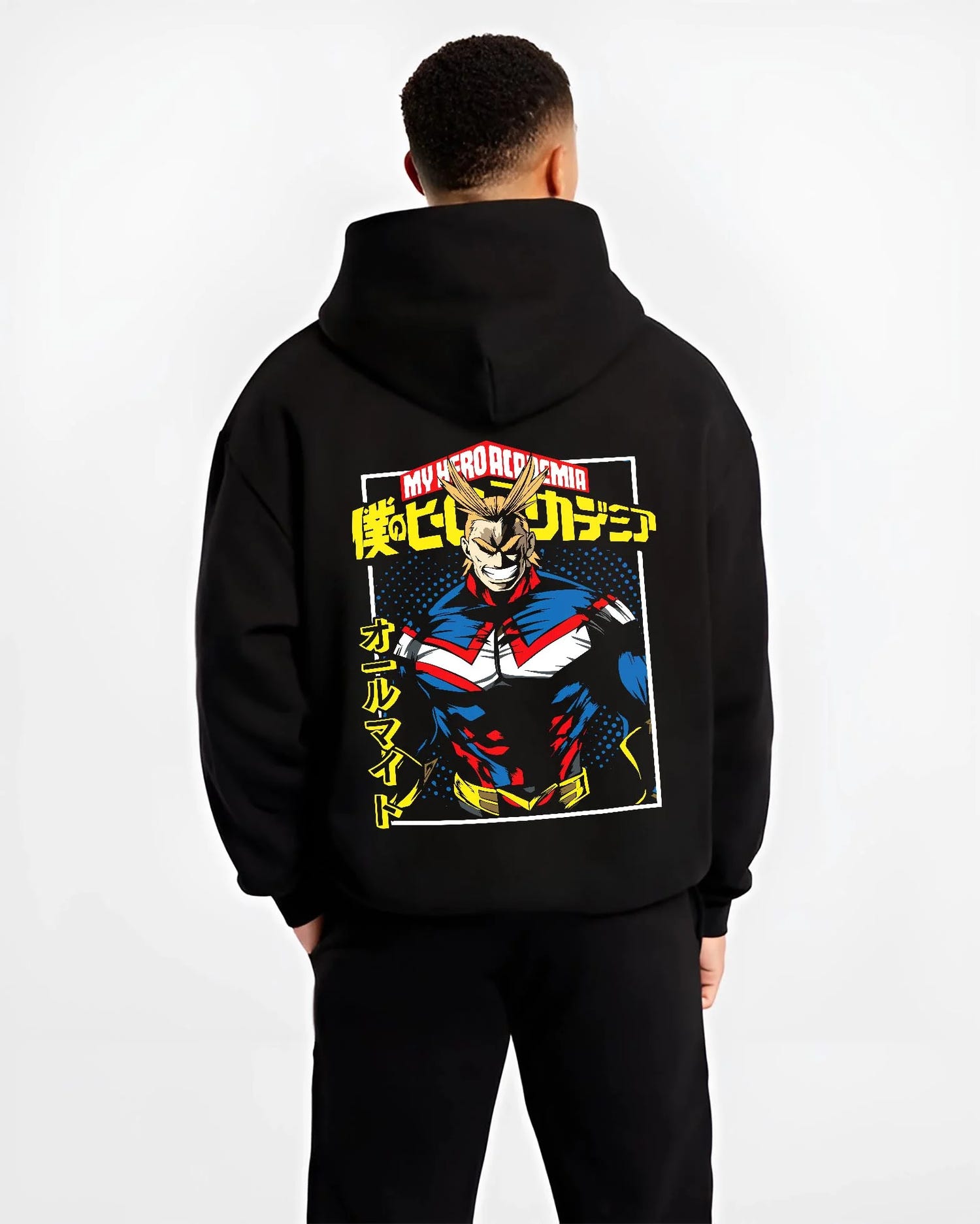 Black hoodie worn by male model, back view with All Might Hero Hoodie My Hero Academia Plus Ultra Bold graphic streetwear graphic.