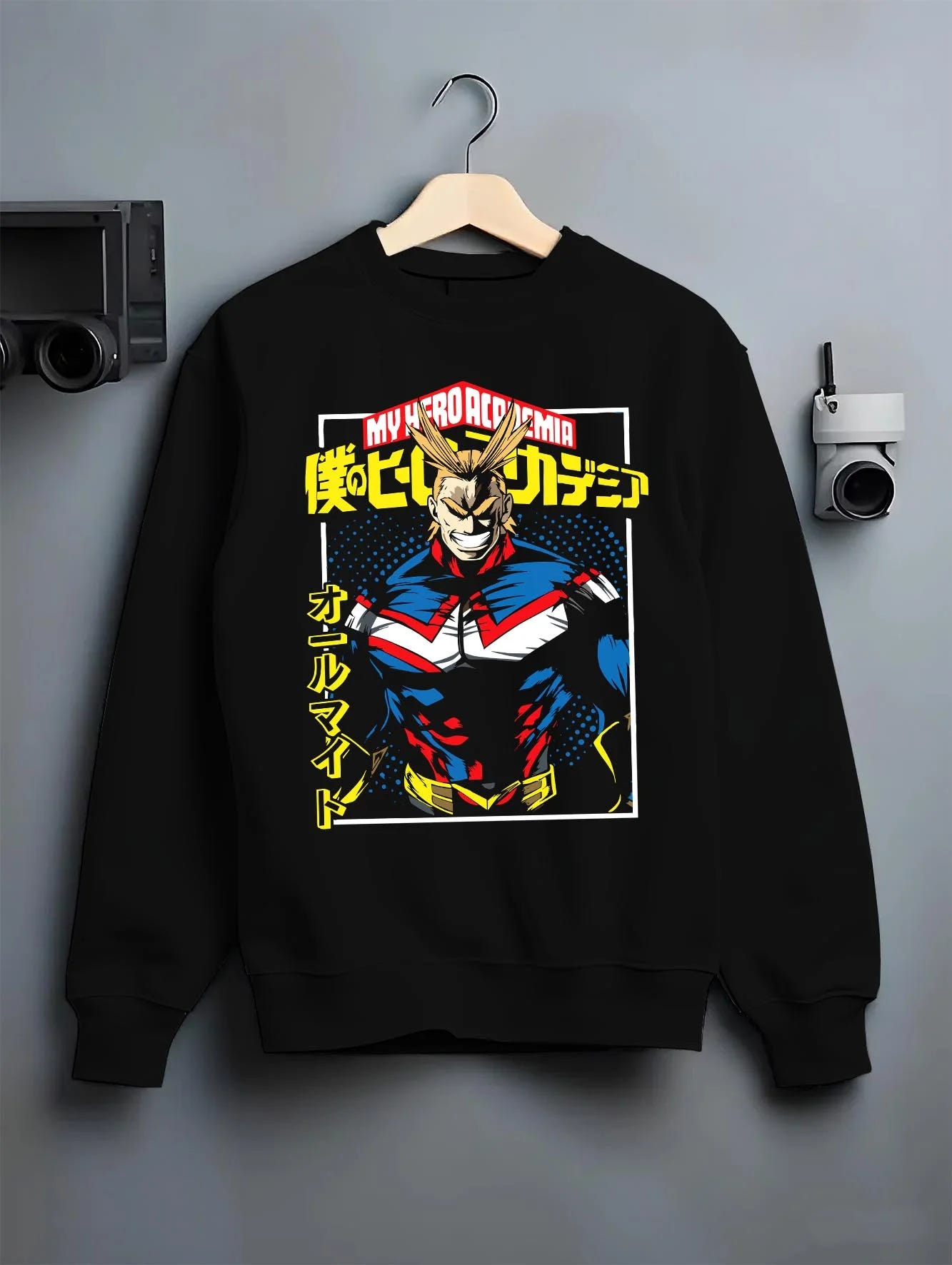 Black crewneck sweatshirt on hanger with All Might Hero Hoodie My Hero Academia Plus Ultra Bold graphic bold anime graphic.
