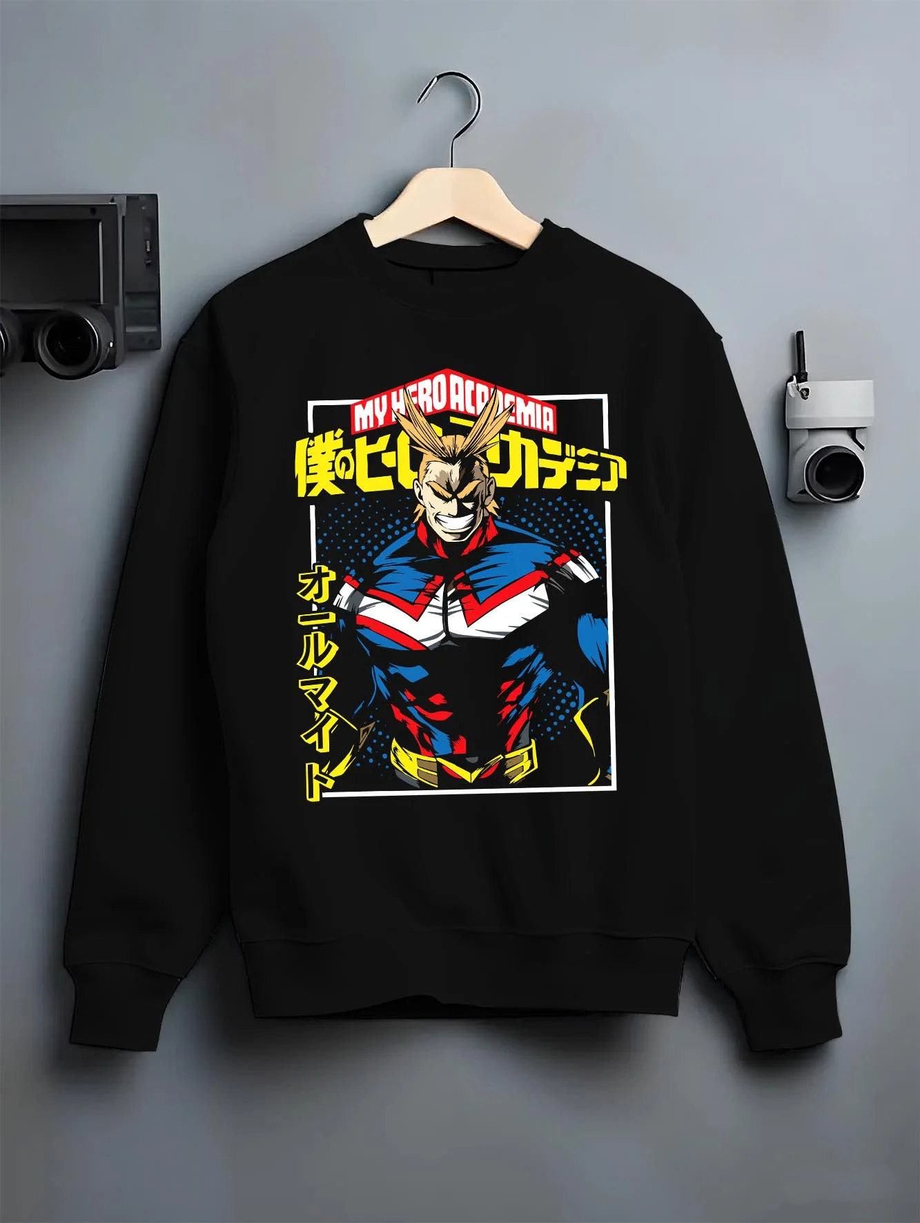 Black crewneck sweatshirt on hanger with All Might Hero Hoodie My Hero Academia Plus Ultra Bold graphic bold anime graphic.