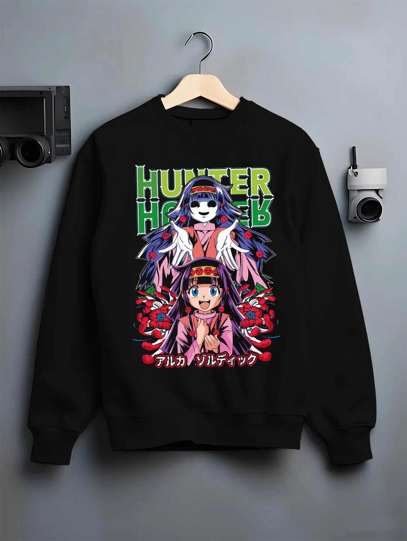 Black crewneck sweatshirt on hanger with Alluka Hoodie Hunter x Hunter Zoldyck Family Dark Print graphic bold anime graphic.