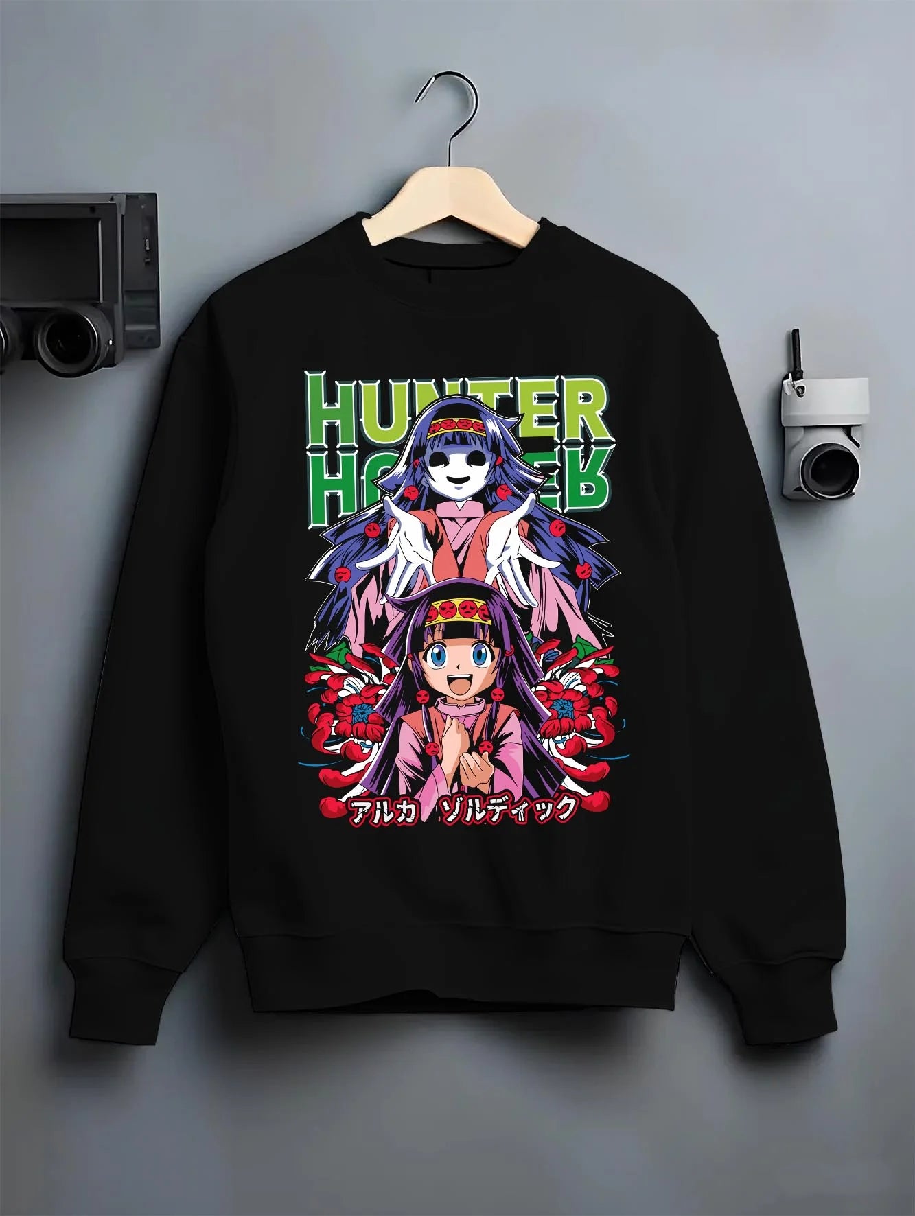Black crewneck sweatshirt on hanger with Alluka Hoodie Hunter x Hunter Zoldyck Family Dark Print graphic bold anime graphic.