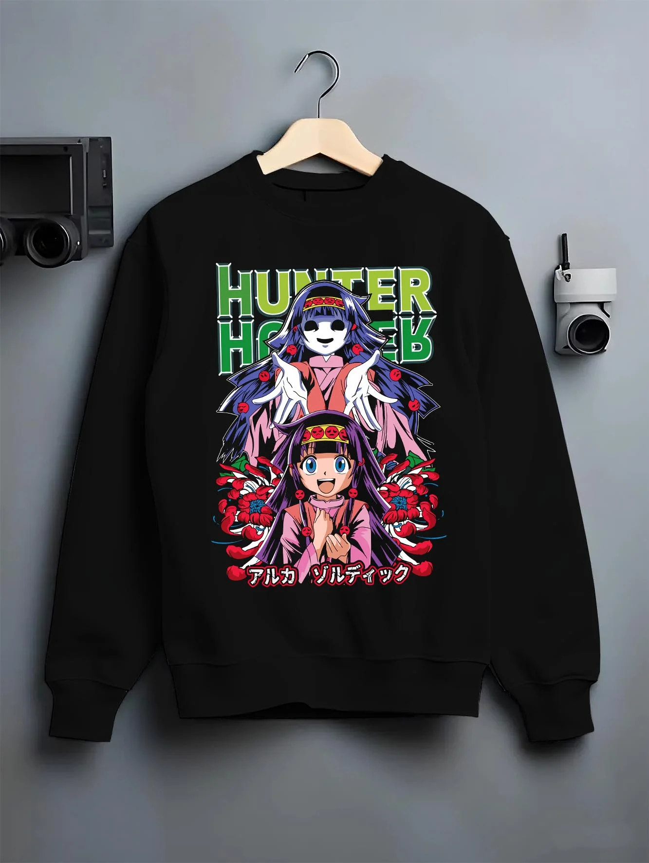 Black crewneck sweatshirt on hanger with Alluka Hoodie Hunter x Hunter Zoldyck Family Dark Print graphic bold anime graphic.