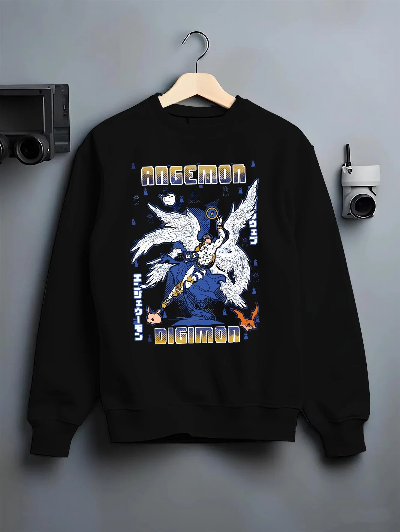 Black crewneck sweatshirt on hanger with Angemon Hoodie Digimon Digital Monster Celestial Form graphic streetwear graphic.