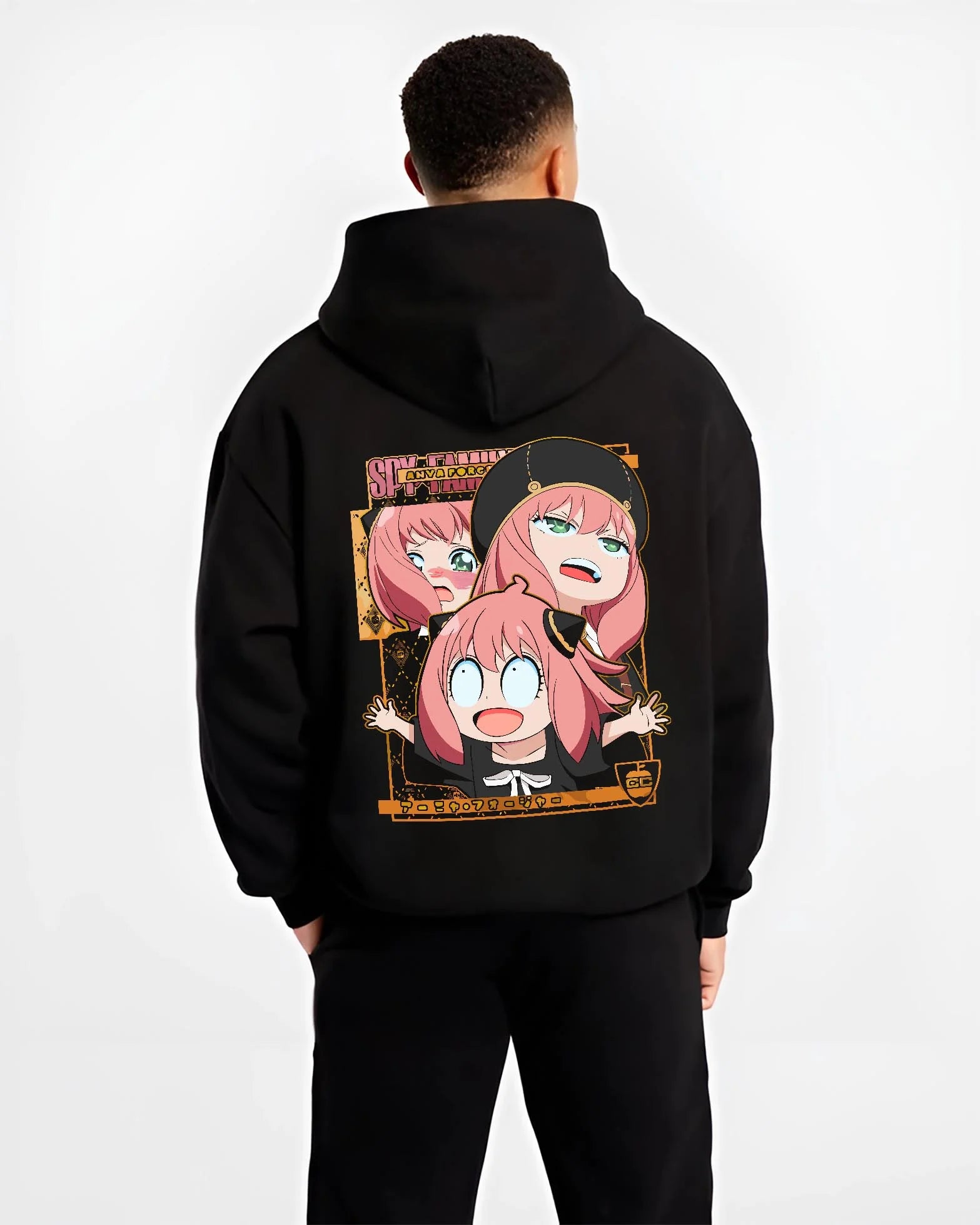 Black hoodie worn by male model, back view with Anya Forger Hoodie Spy x Family Funny Faces Expression graphic bold anime graphic.