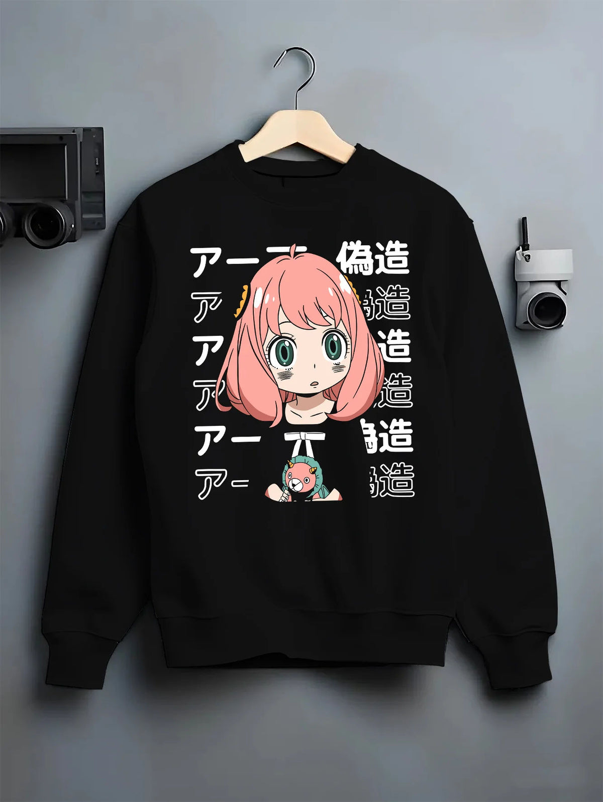 Black crewneck sweatshirt on hanger with Anya Forger from Spy x Family illustrated back graphic