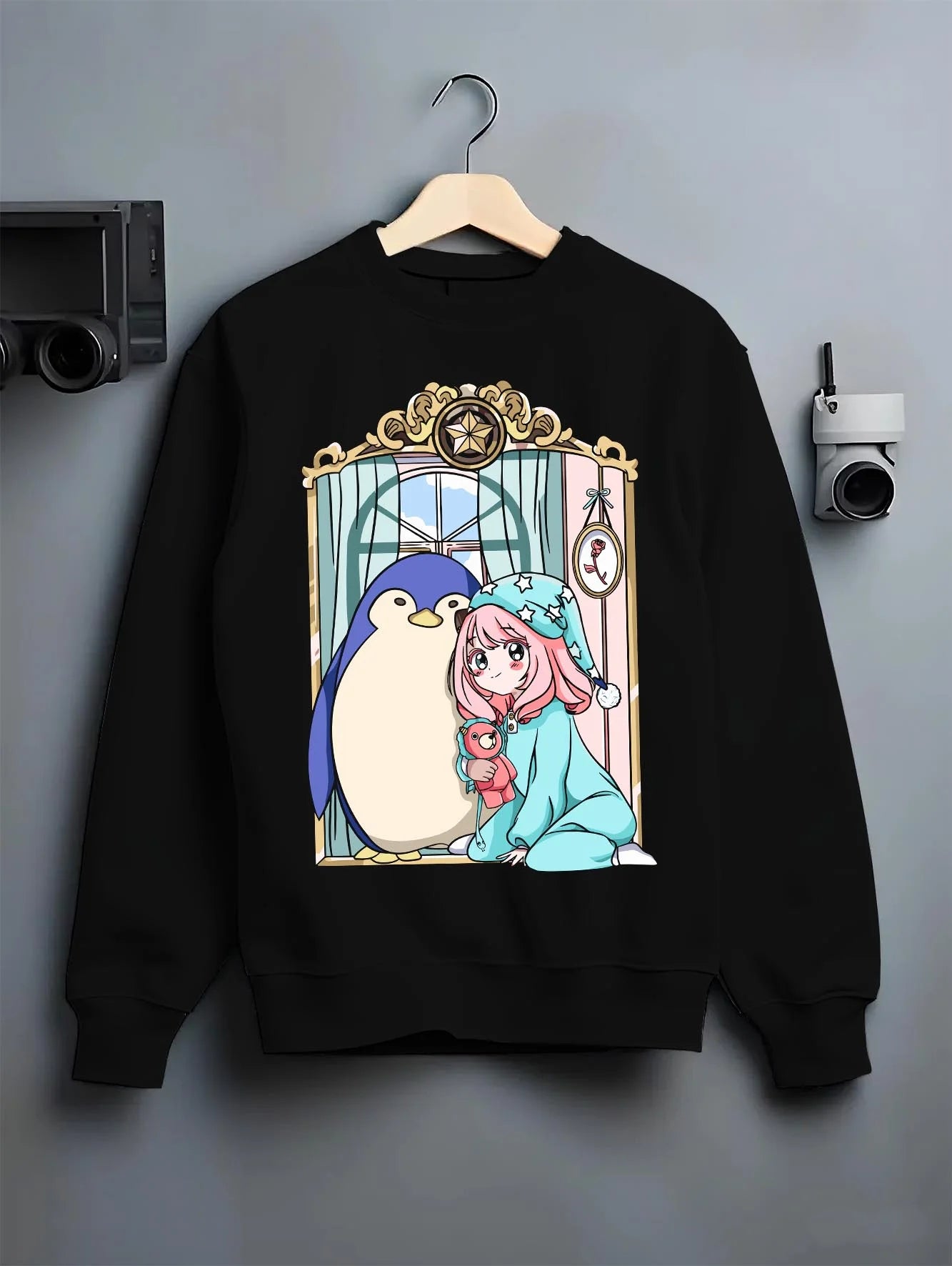 Black crewneck sweatshirt on hanger with Anya Forger Hoodie Spy x Family Sleeping Plush Doll graphic streetwear graphic.