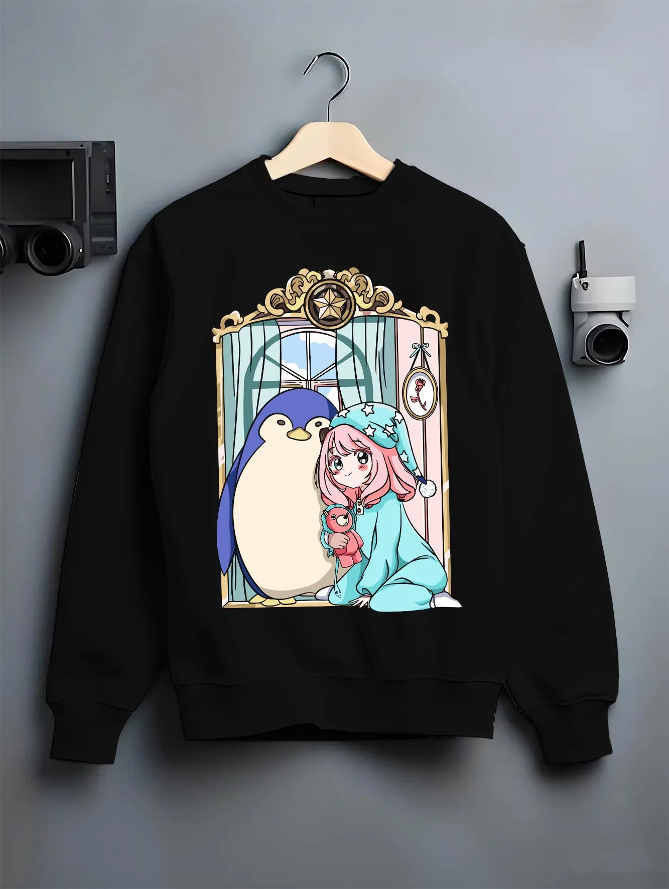 Black crewneck sweatshirt on hanger with Anya Forger Hoodie Spy x Family Sleeping Plush Doll graphic streetwear graphic.