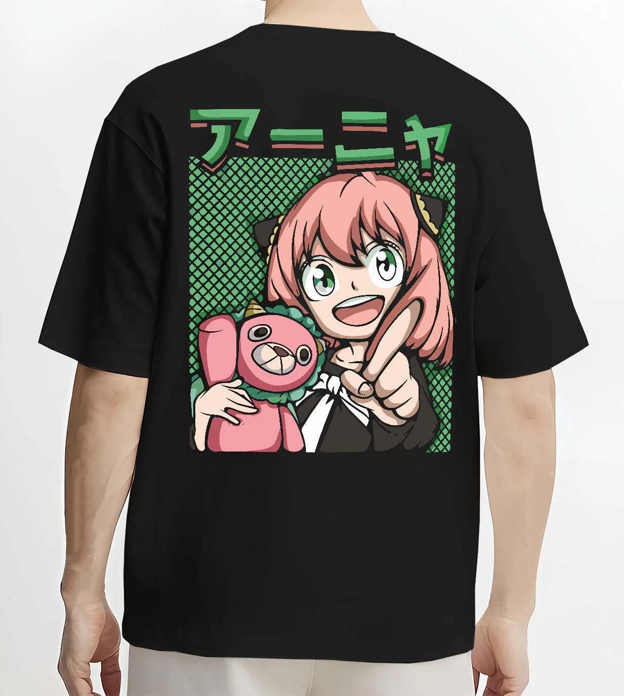 Black T-shirt worn by male model, back view with Anya Forger Hoodie Spy x Family Retro Pop Art Smile graphic premium wear.