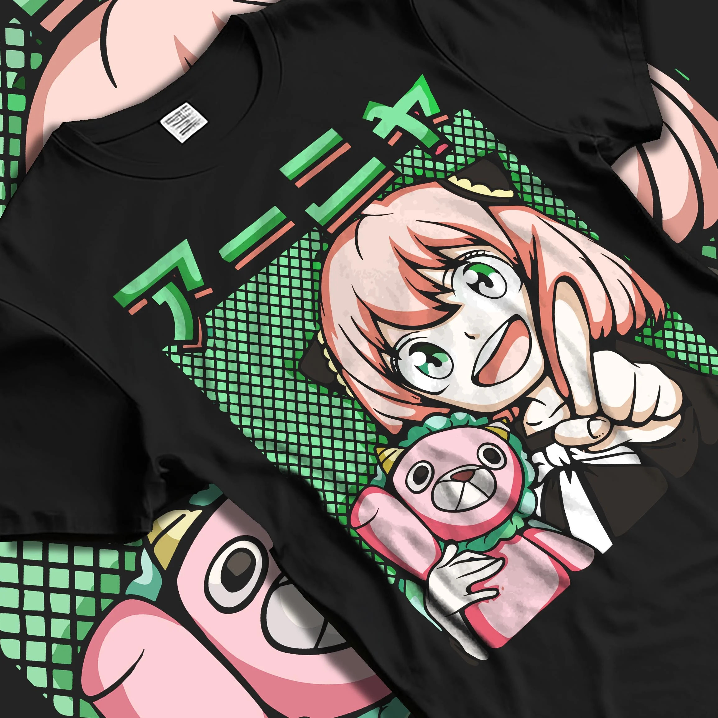 Black T-shirt laid flat with natural folds with Anya Forger Hoodie Spy x Family Retro Pop Art Smile graphic premium wear.