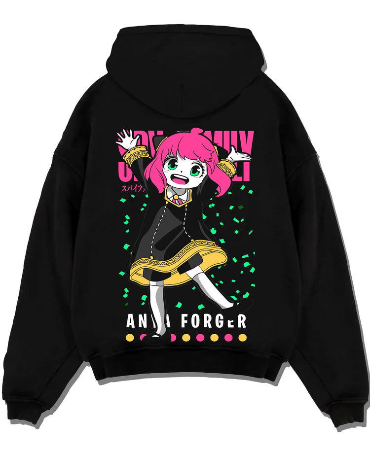 Black pullover hoodie laid flat with Anya Forger Hoodie Spy x Family Pink Hair Jump Scene graphic bold anime graphic.