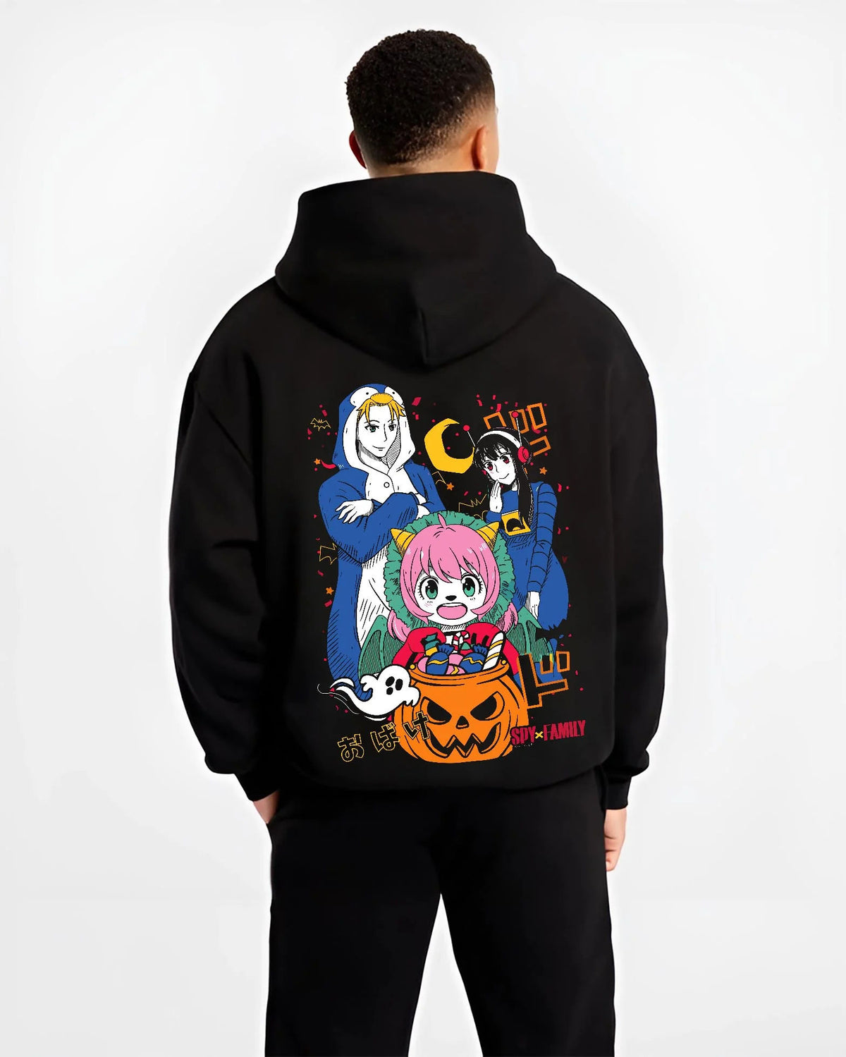 Black hoodie worn by male model from the back featuring Anya Forger Halloween Spy x Family pumpkin-night artwork.