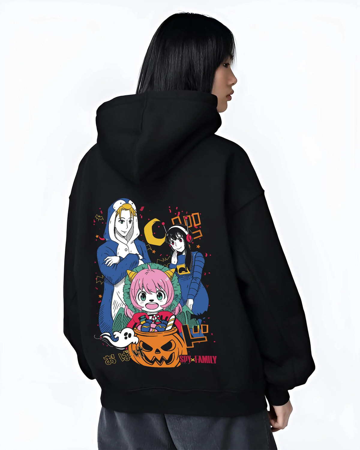 Black hoodie worn by female model from the back featuring Anya Forger Halloween Spy x Family pumpkin-night artwork.